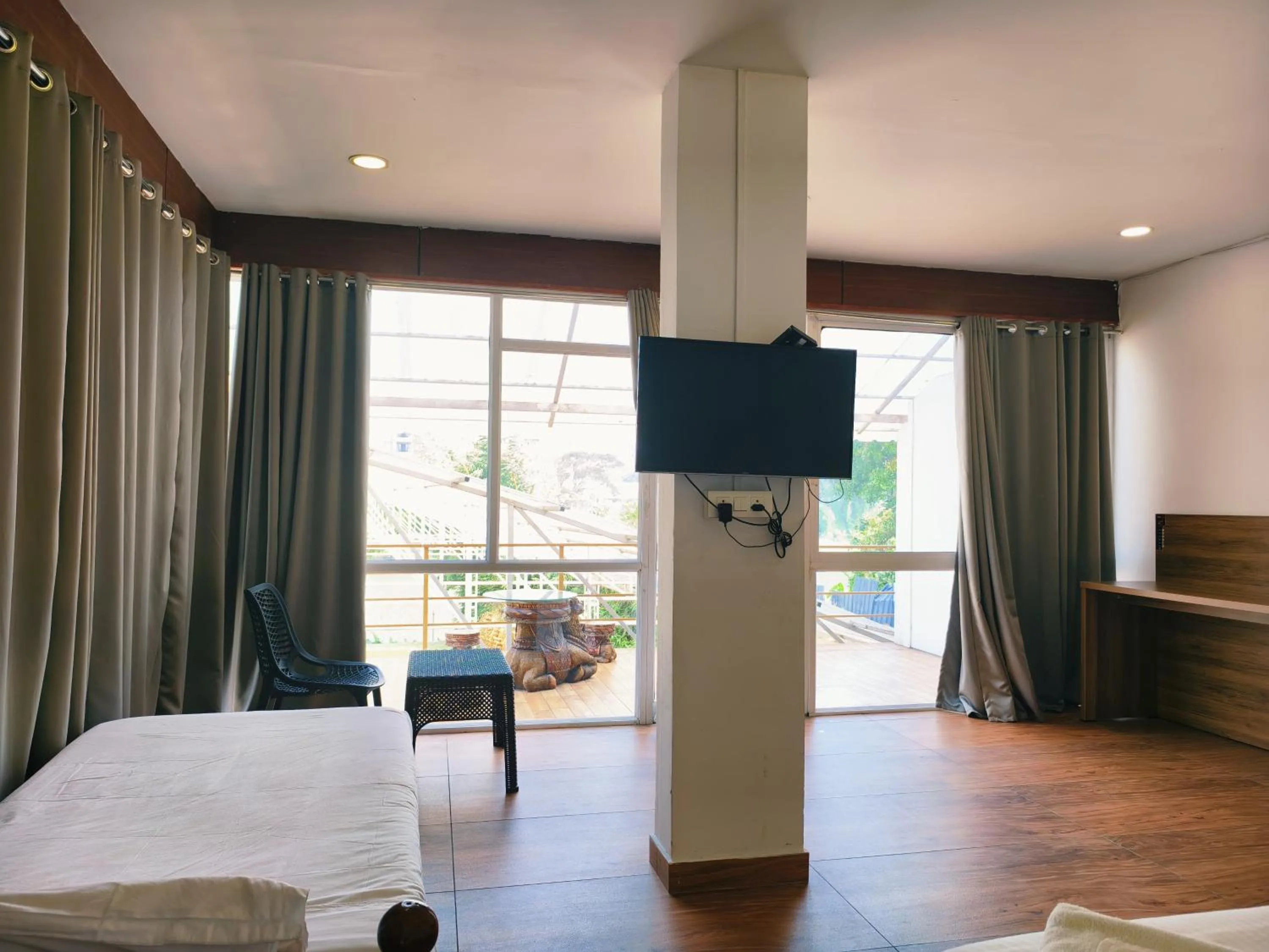 Communal lounge/ TV room, Bed in Udaya Resort