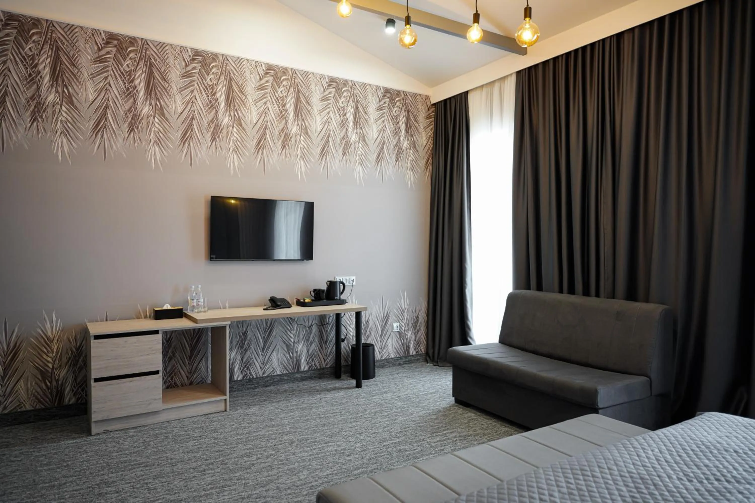 Communal lounge/ TV room, Bed in Dynasty Hotel & SPA