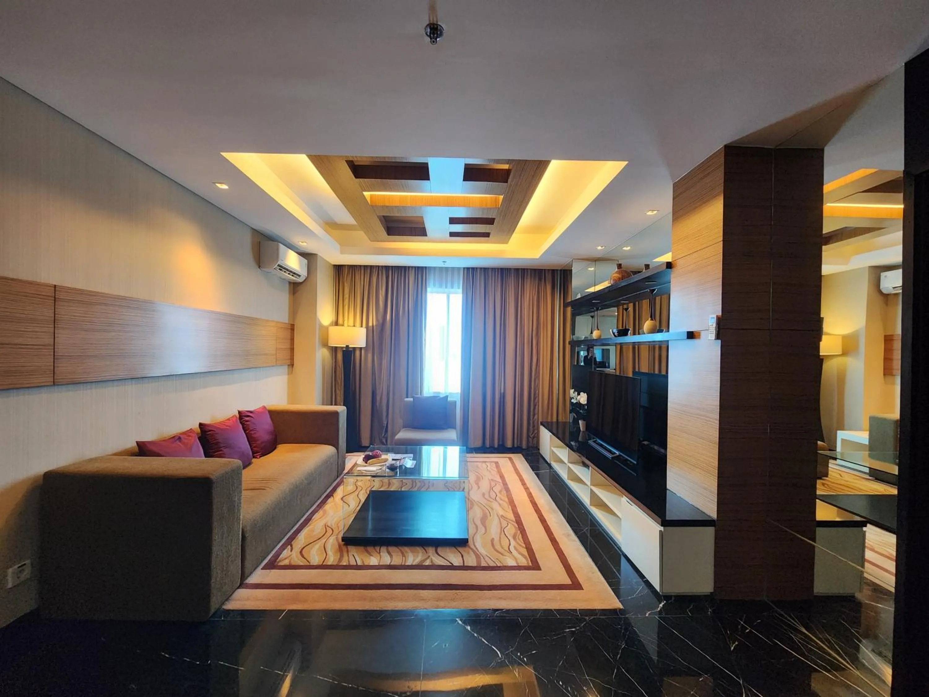 Living room, Bed in Novotel Balikpapan