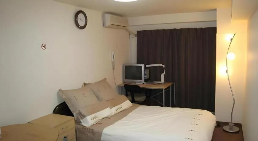 Bed in Itabashi Hotel Hilltop