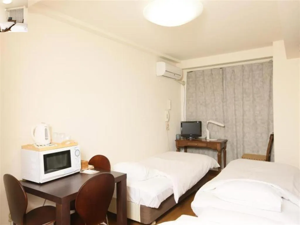 Bed in Itabashi Hotel Hilltop