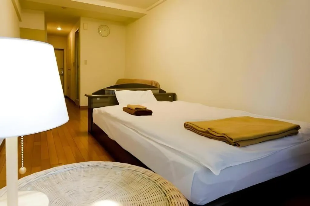 Bed in Itabashi Hotel Hilltop