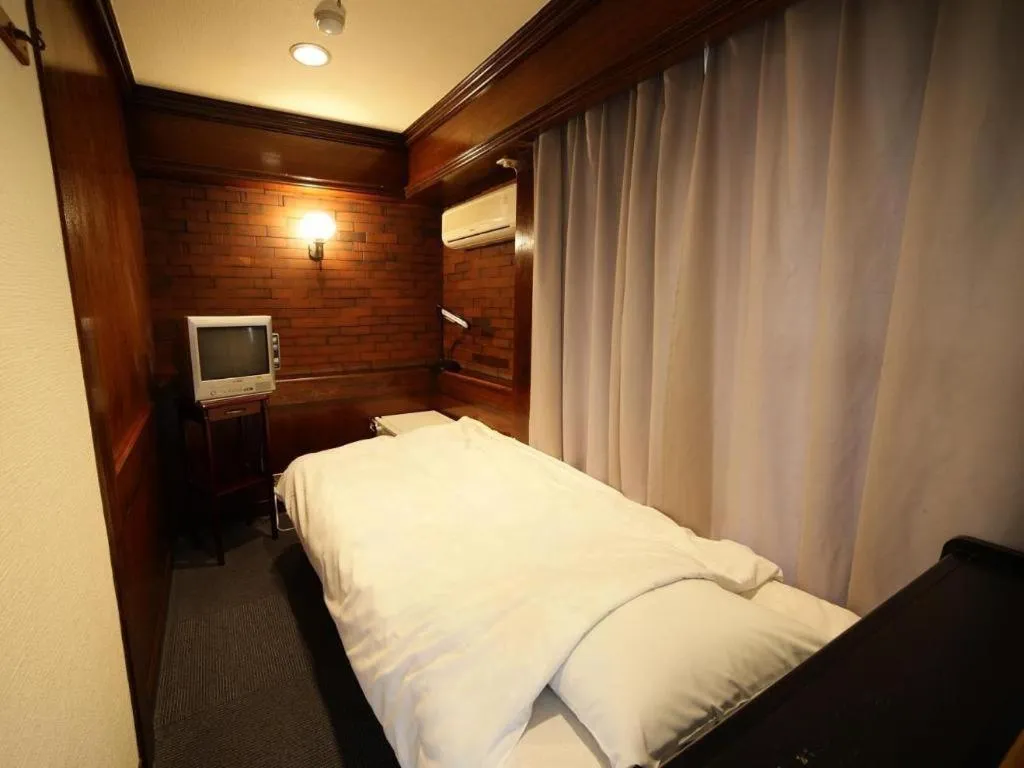 Bed in Itabashi Hotel Hilltop