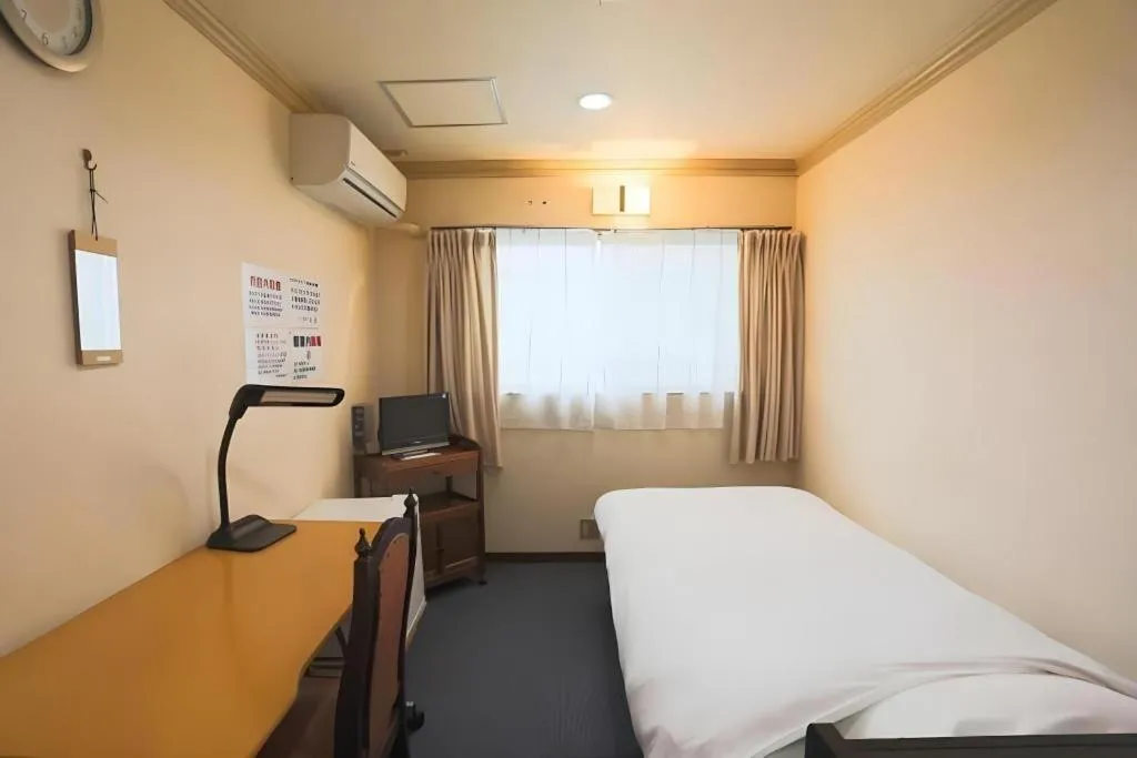 Bed in Itabashi Hotel Hilltop