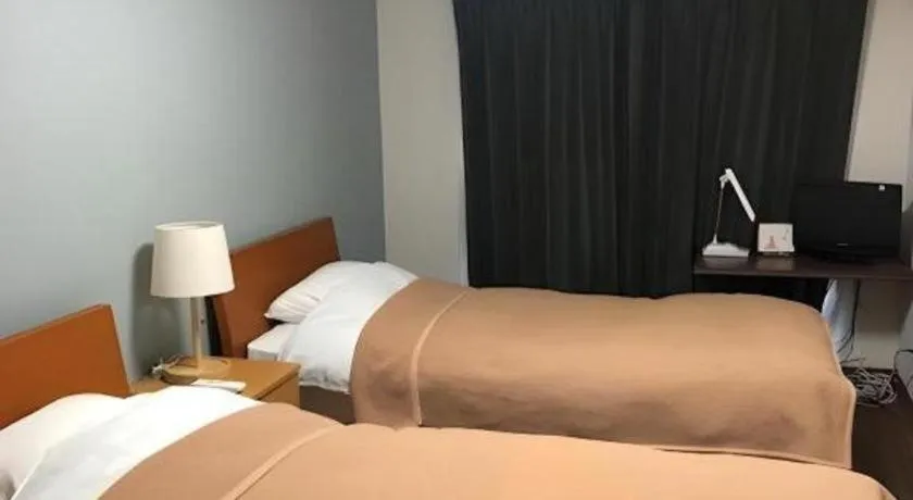 Bed in Itabashi Hotel Hilltop