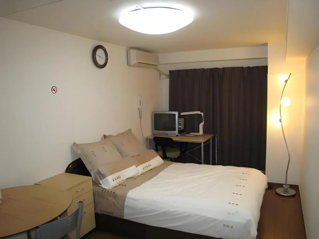 Bed in Itabashi Hotel Hilltop