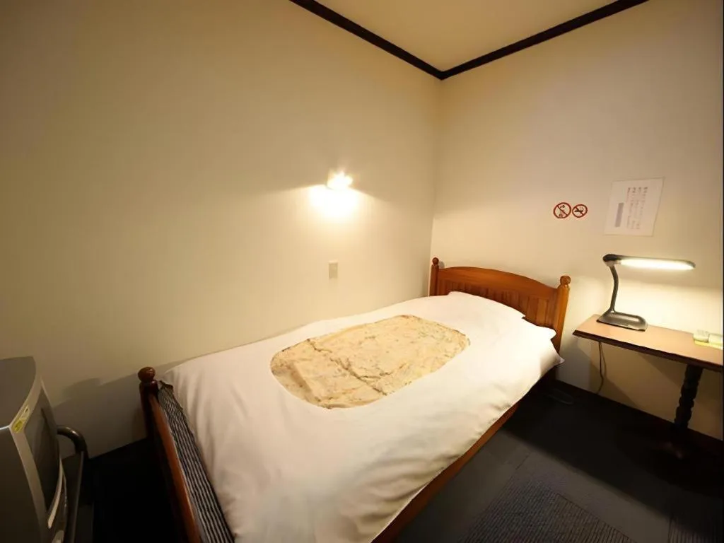 Bed in Itabashi Hotel Hilltop