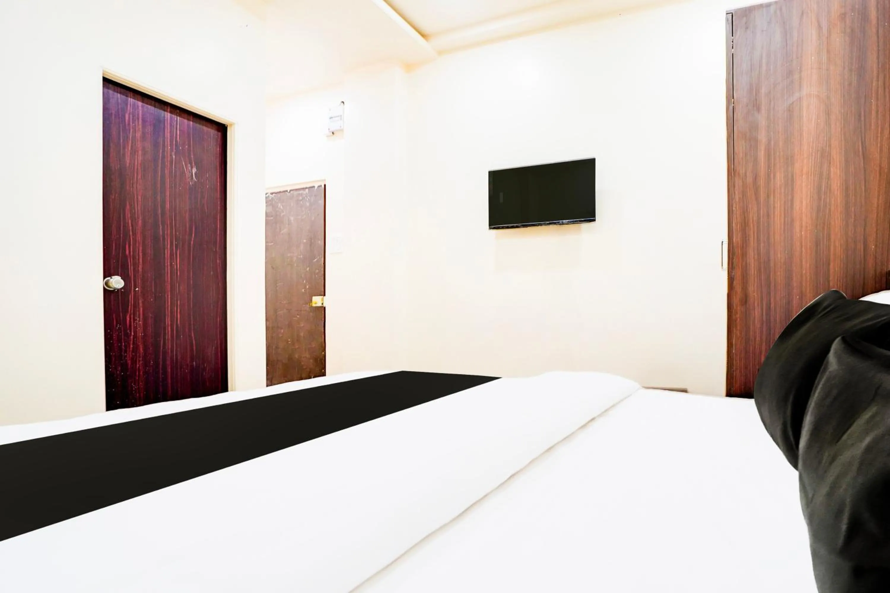 Bedroom in Hotel O UTS STAY IN