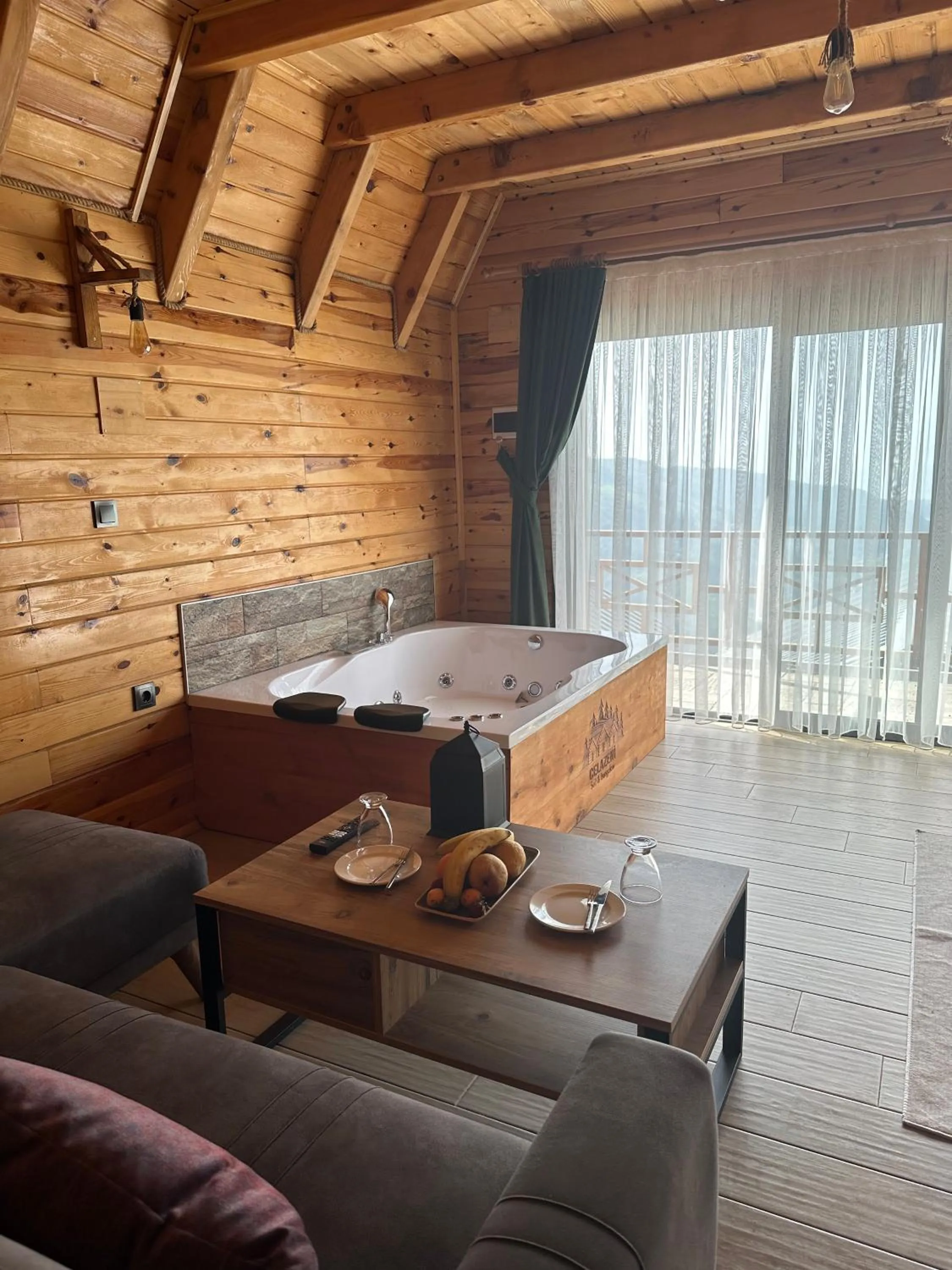 Living room, Bed in PUGARi HOTEL