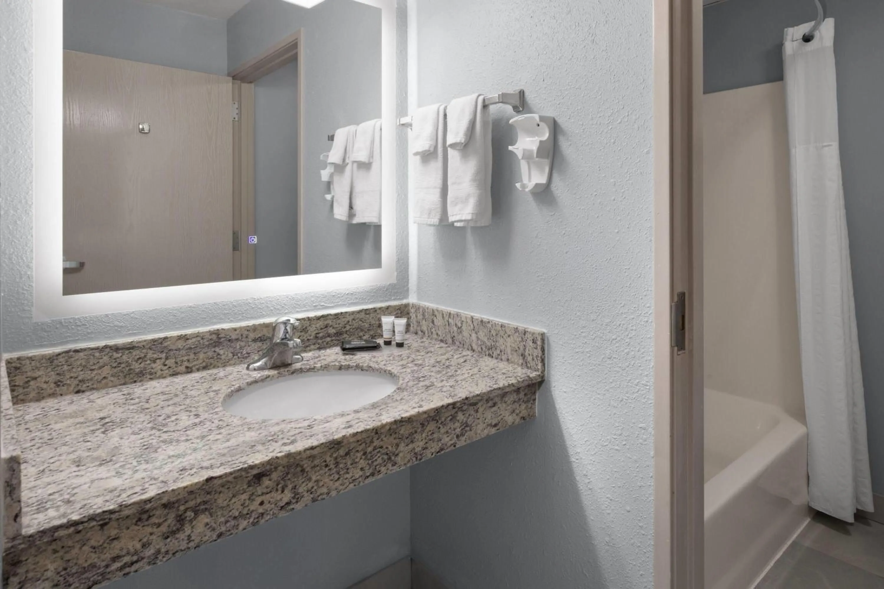 Bathroom in AmericInn by Wyndham Douglas/Saugatuck