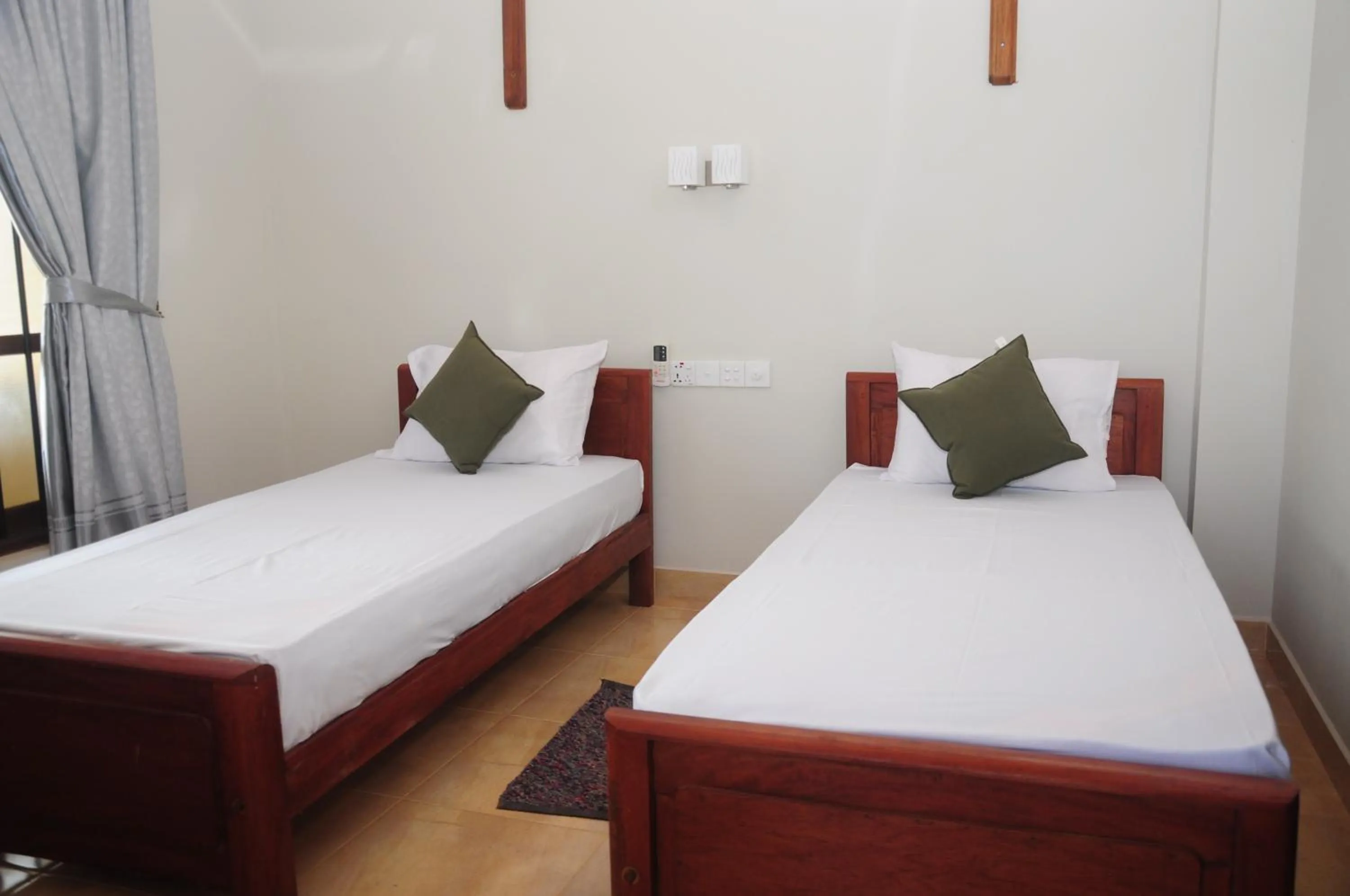 Bed in Traveller's Home Hotel