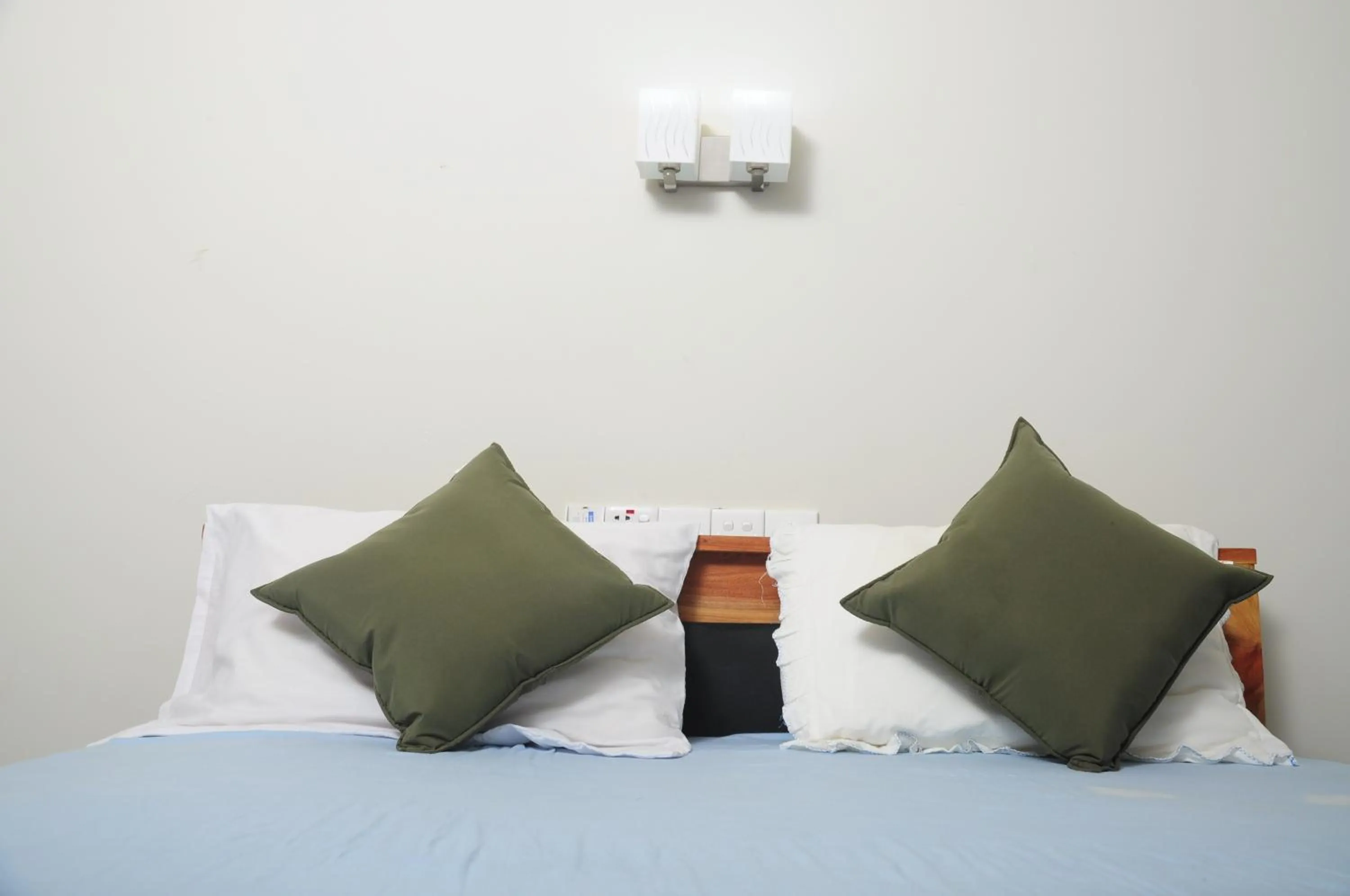 Bed in Traveller's Home Hotel