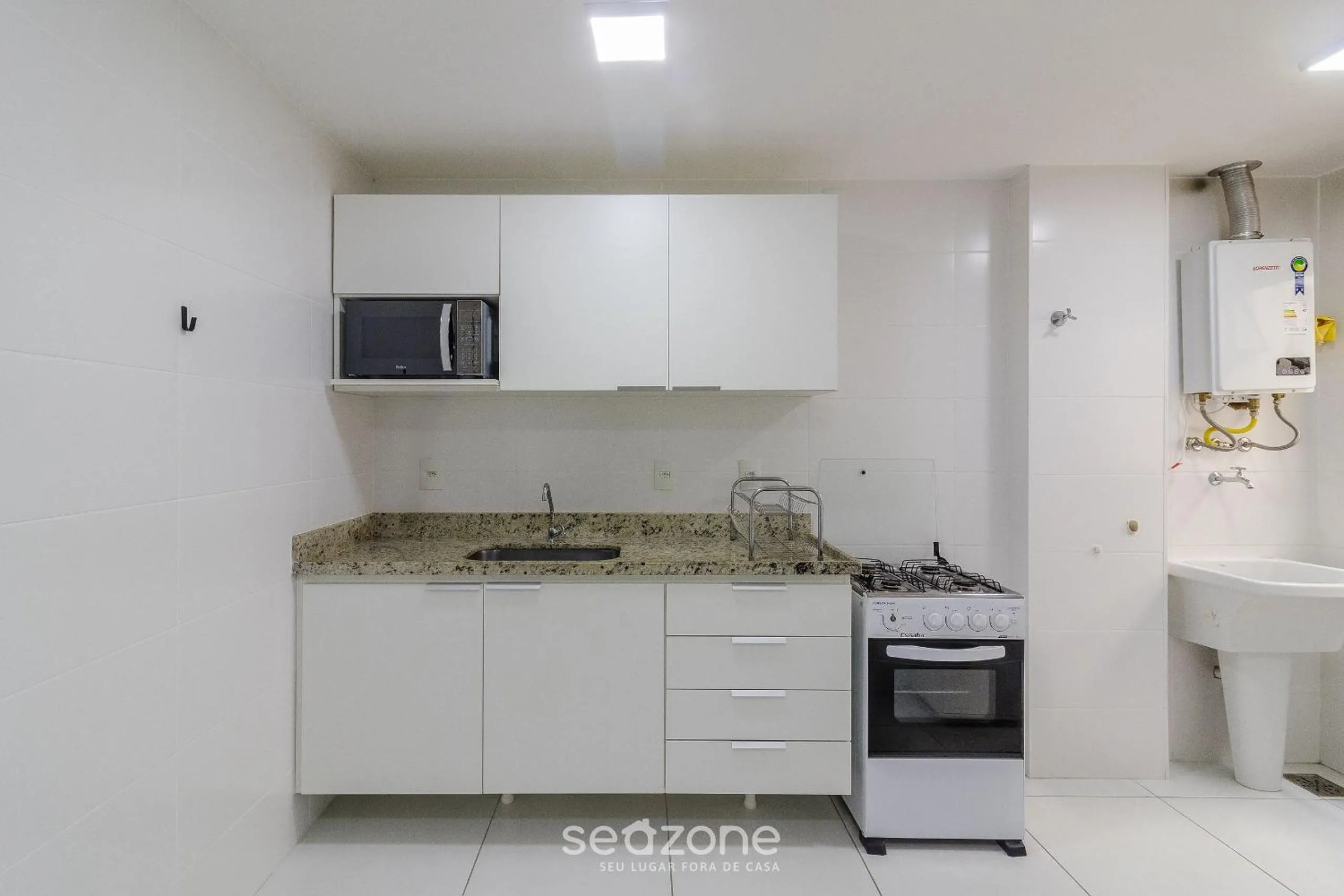 Kitchen or kitchenette in Encantador apto em Cabo Frio SDA311