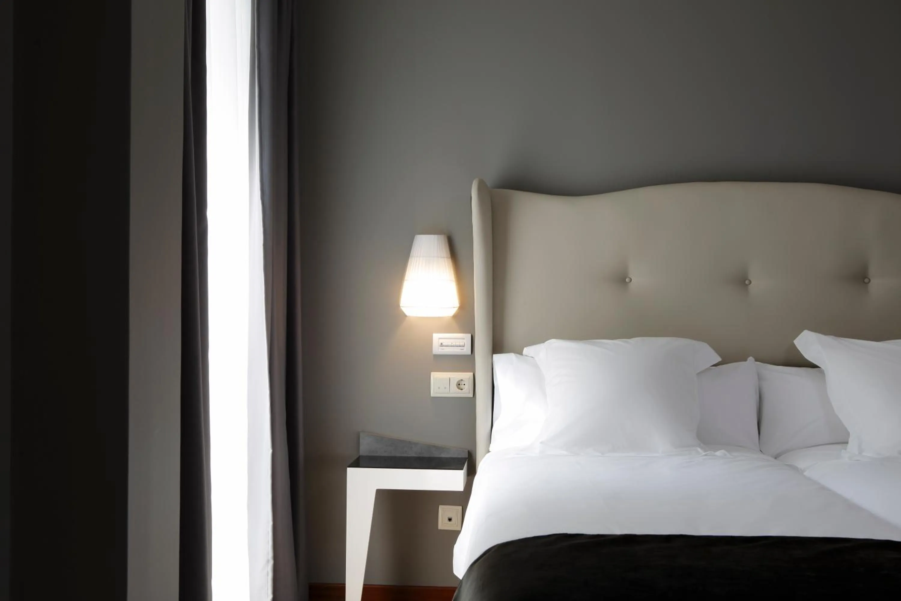 Bed in Capitol Boutique Hotel