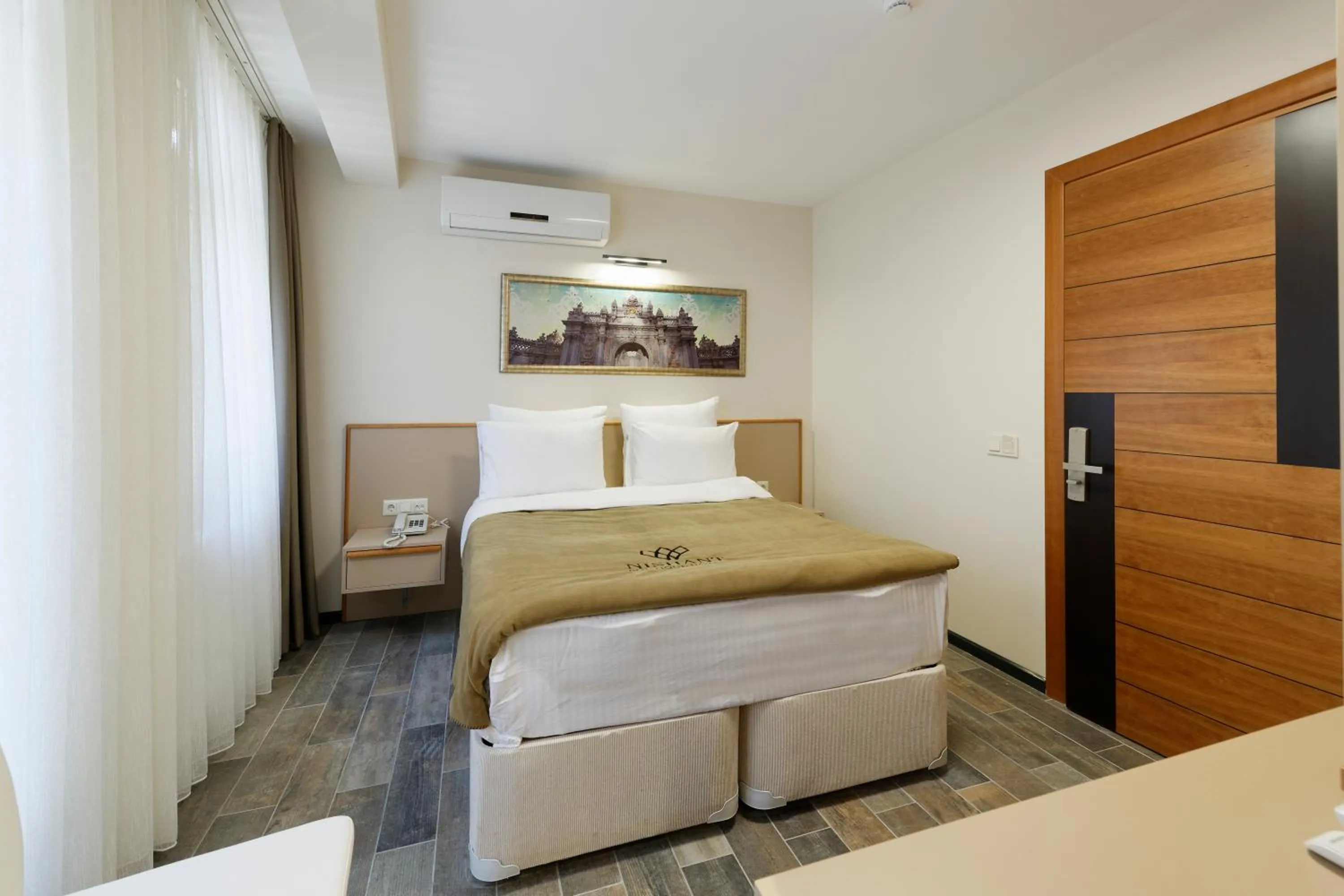 Photo of the whole room, Bed in Nishant Hotel