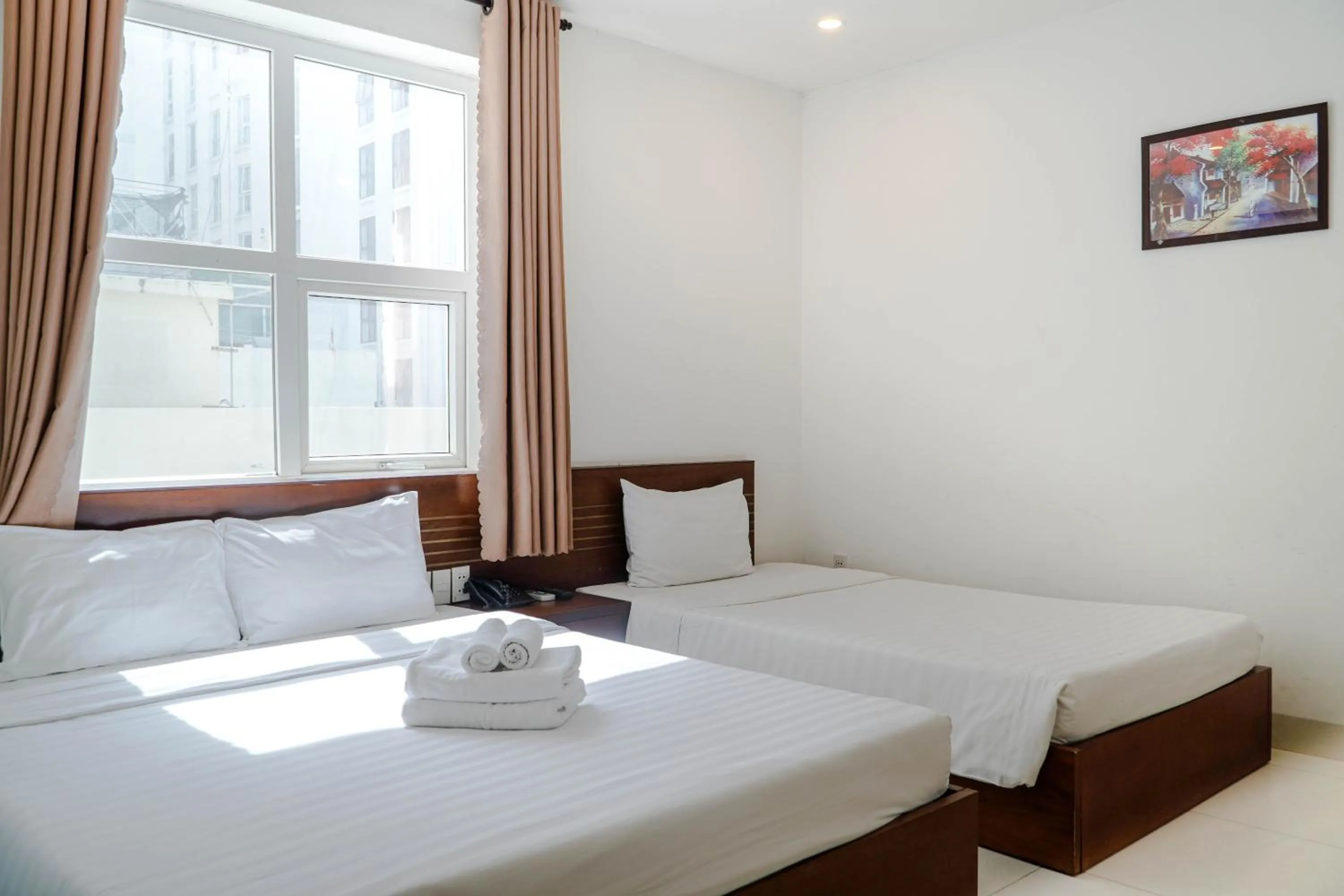 Bed in Golden Light Da Nang Hotel