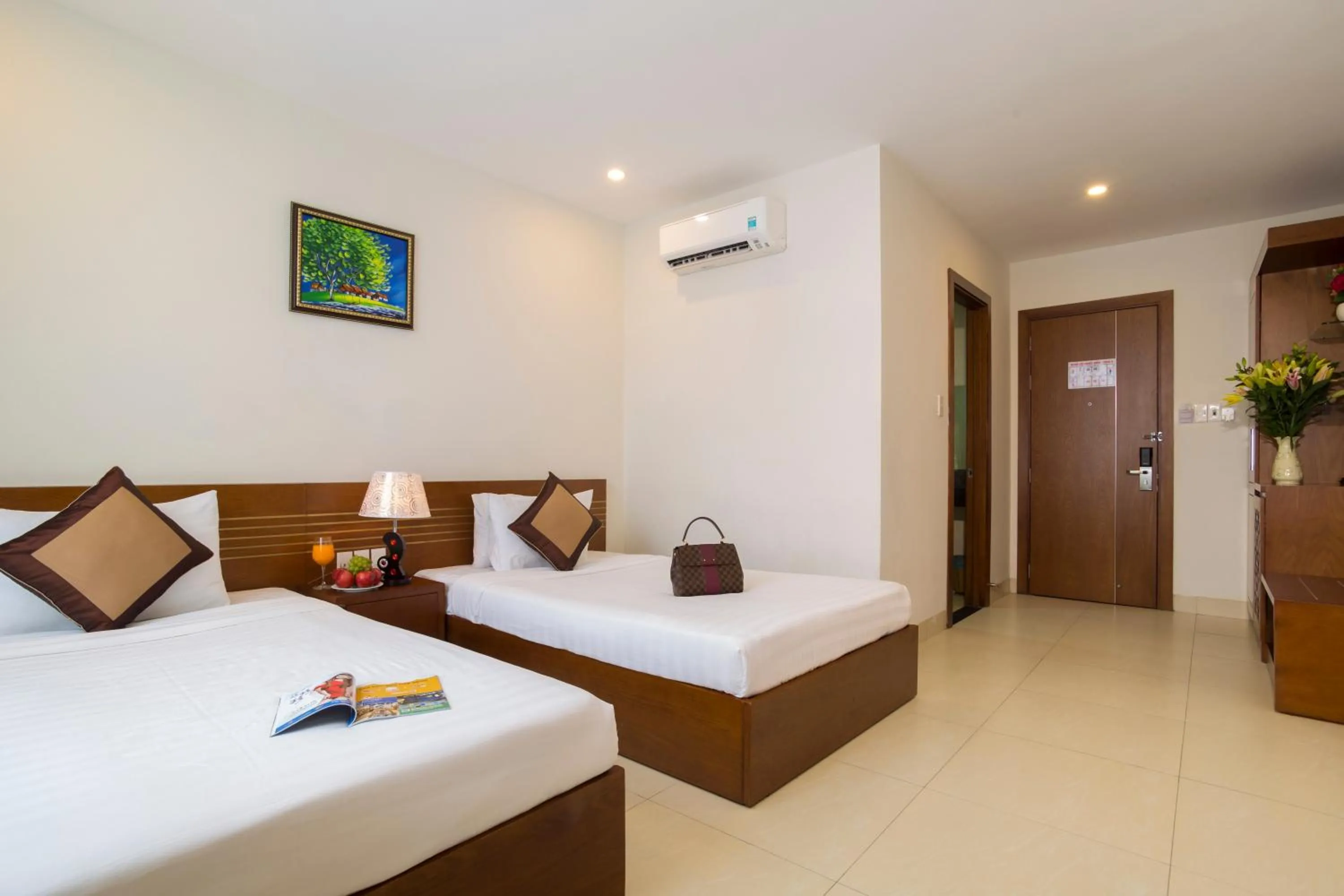 Bed in Golden Light Da Nang Hotel