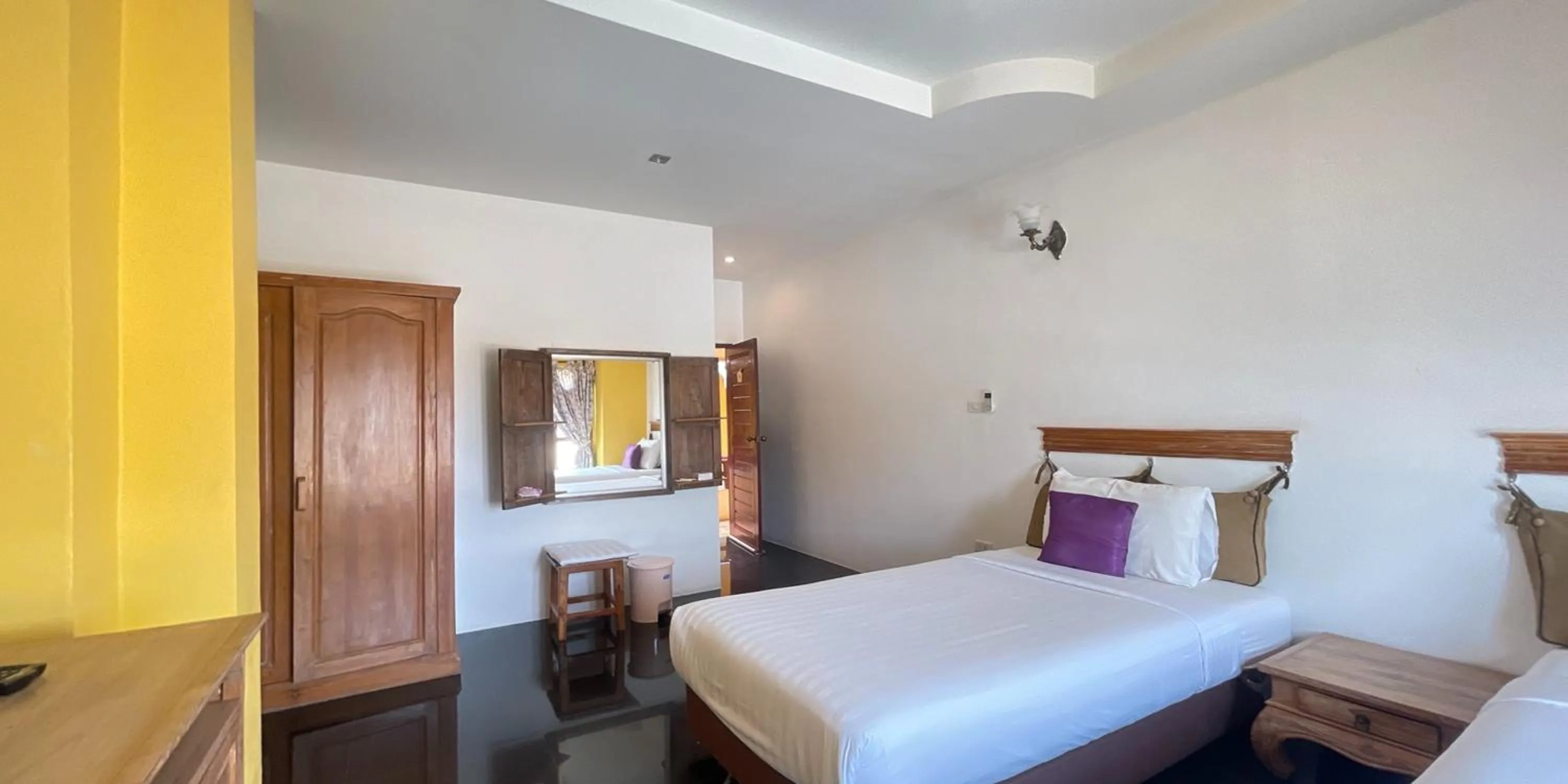 Bed in Yellow Tique Hotel