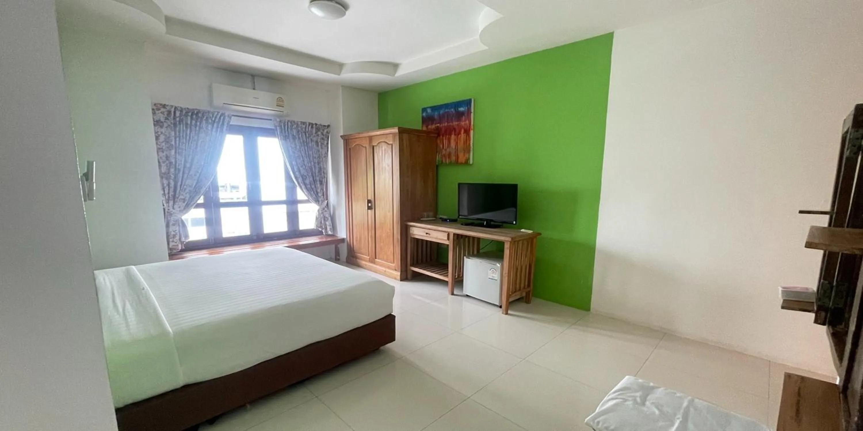 Bed in Yellow Tique Hotel