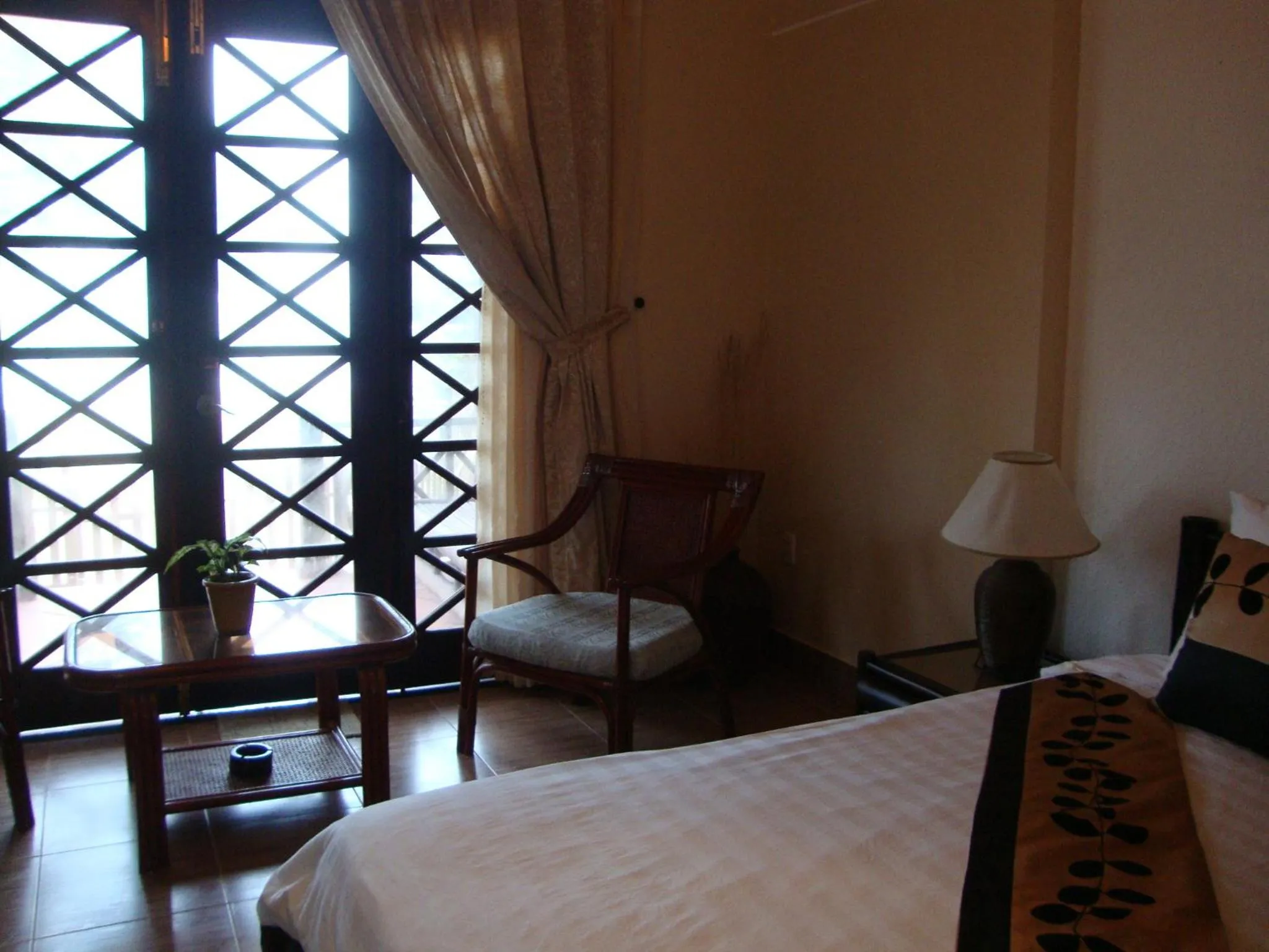 Seating area, Bed in Orchid Boutique Beach Resort