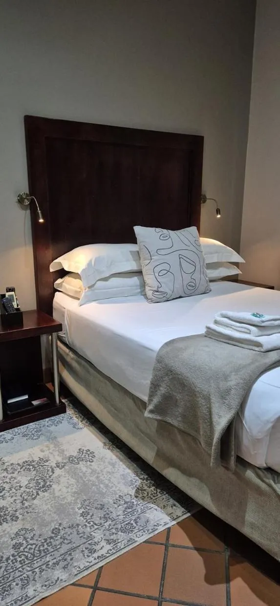 Bedroom, Bed in Elegant Lodge & Conference Center