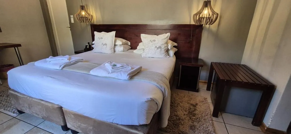 Bedroom, Bed in Elegant Lodge & Conference Center