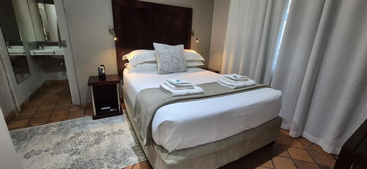 Bedroom, Bed in Elegant Lodge & Conference Center