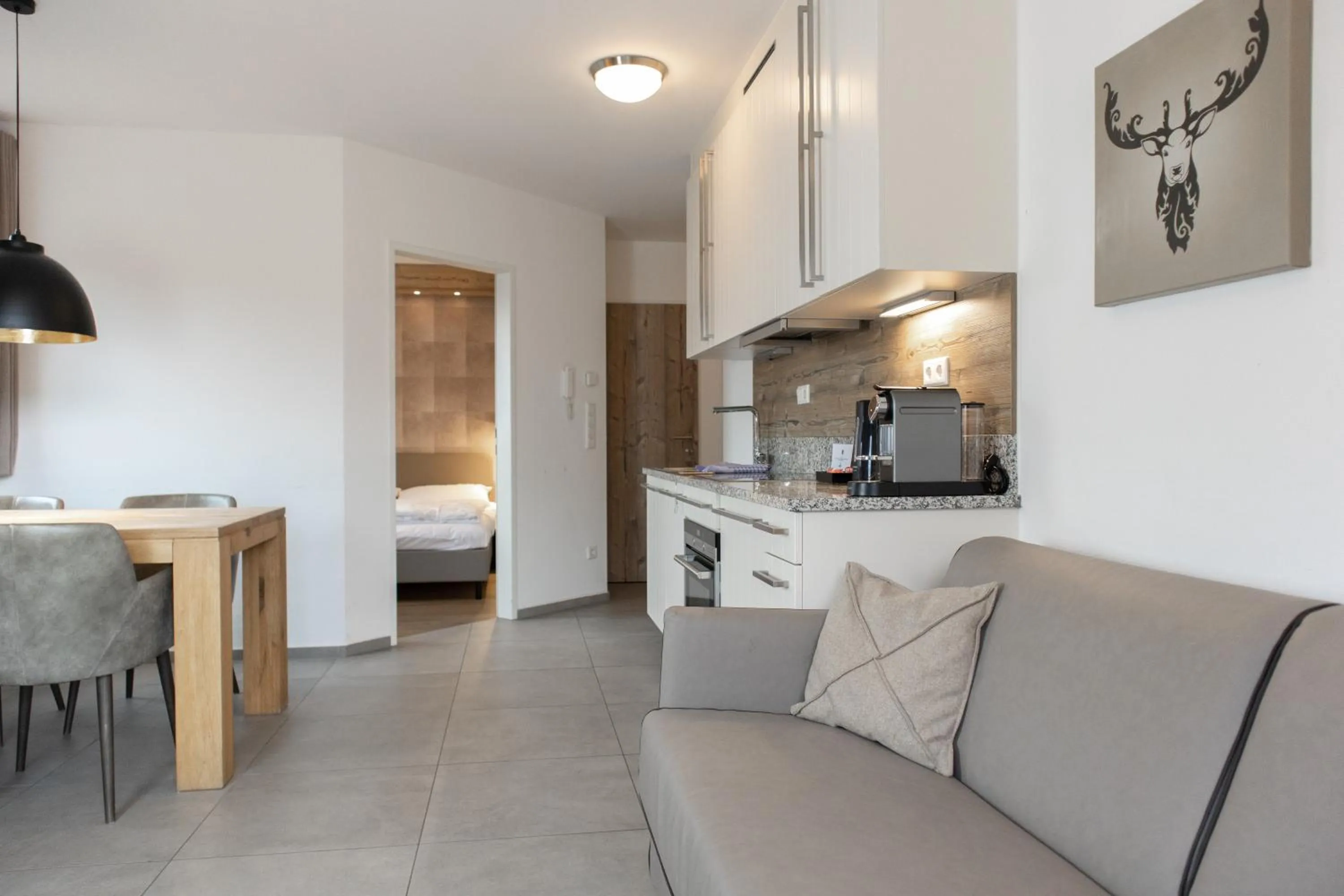 Living room, Bed in Ski & Golf Suites Zell am See by Alpin Rentals