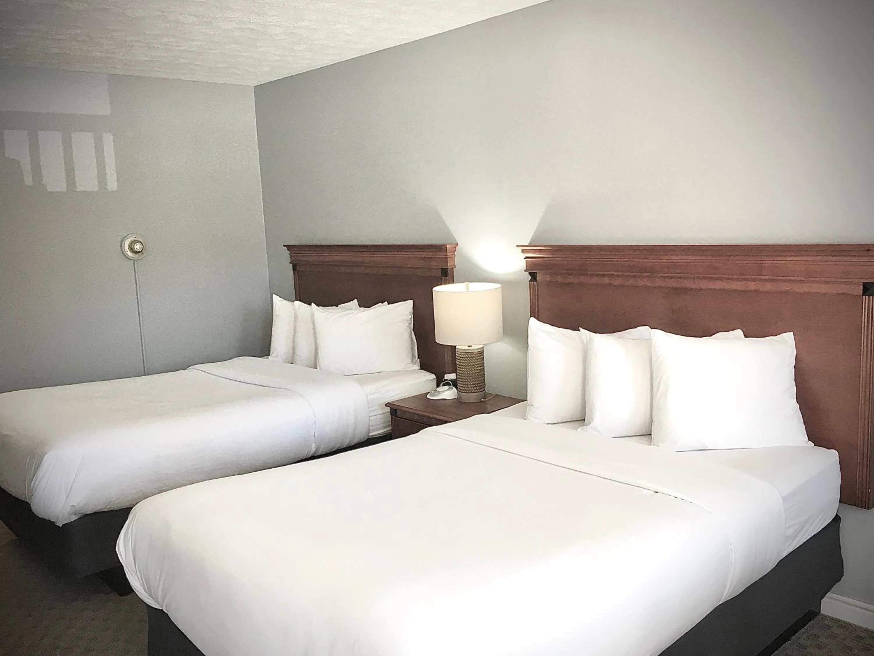 Bed in Empire Lakeshore Inn