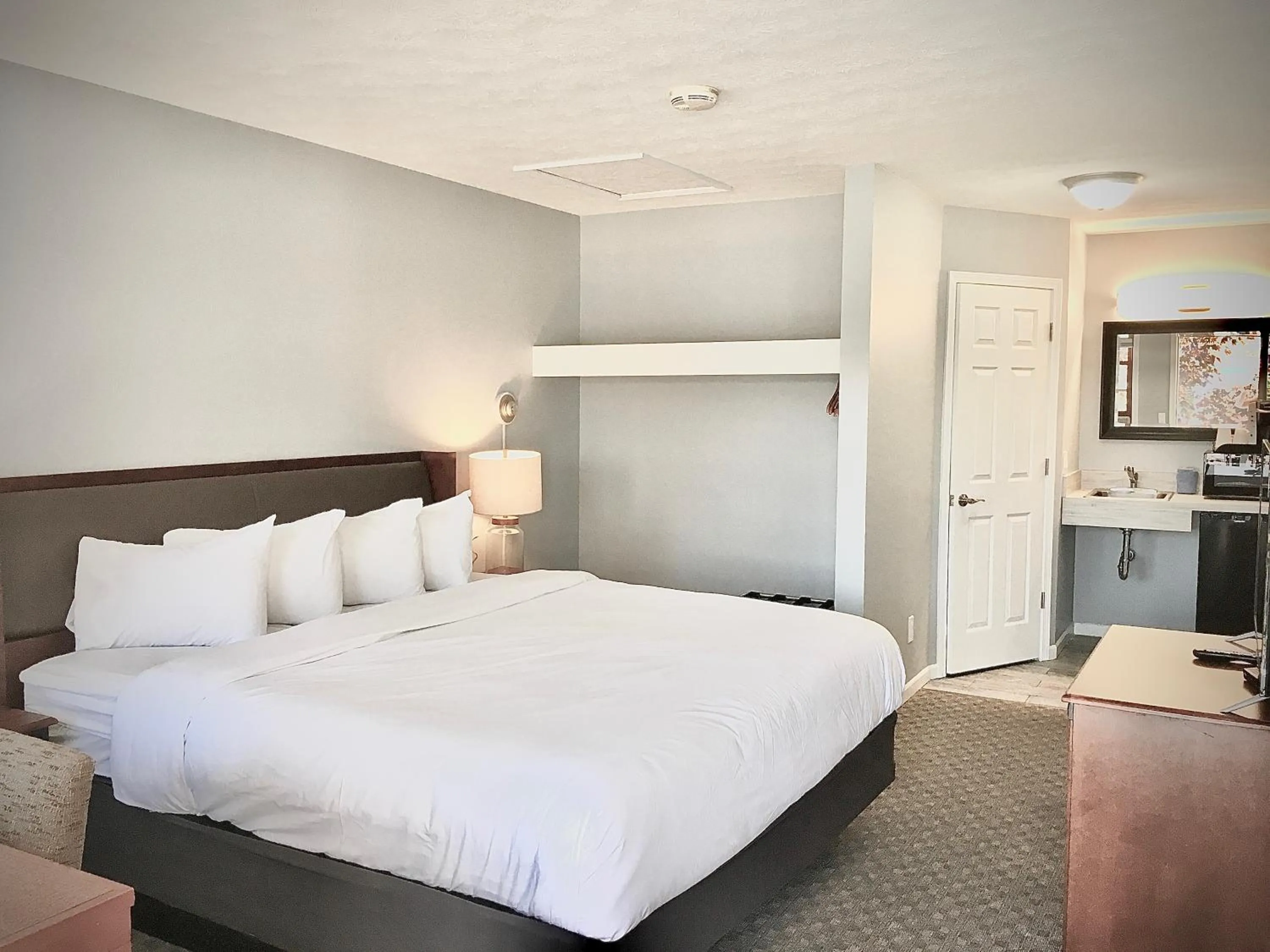 Bed in Empire Lakeshore Inn