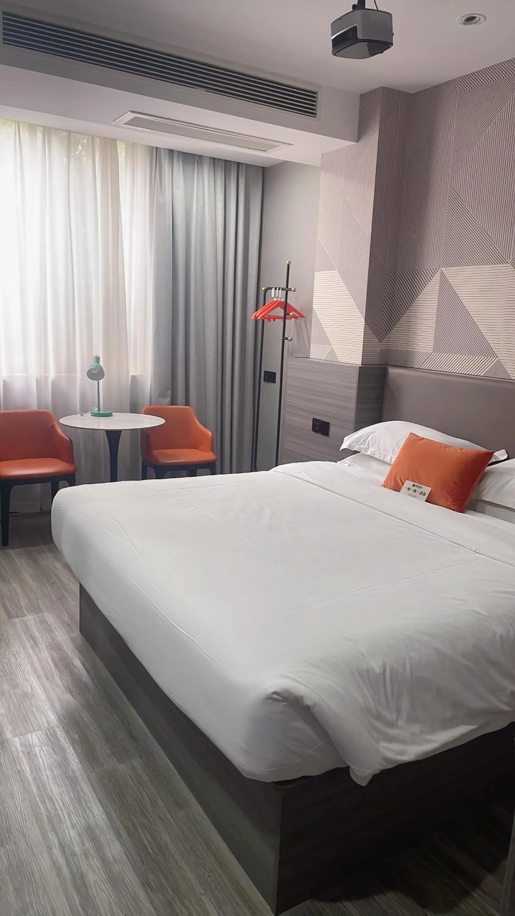 Bed in Orient Rose International Hotel