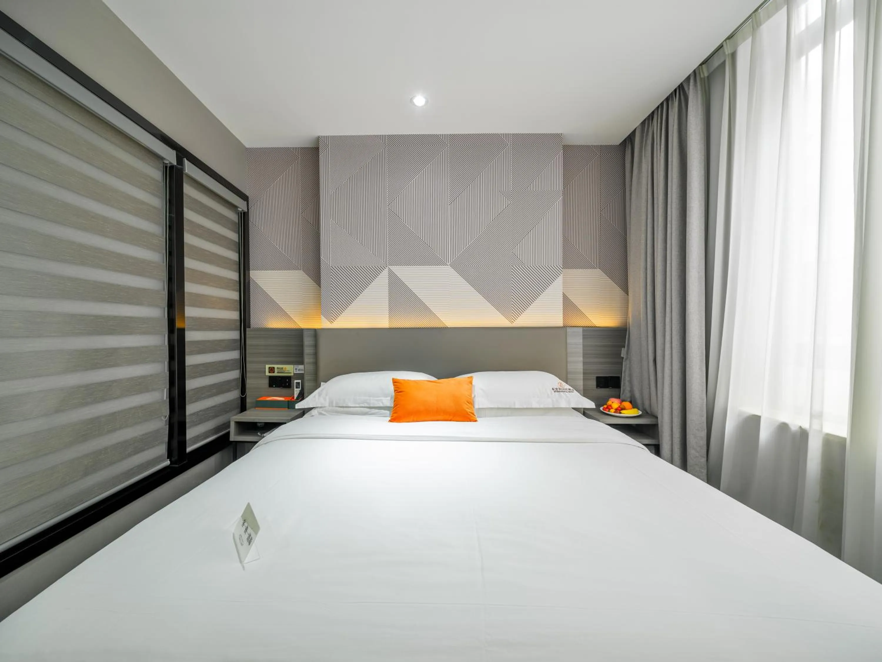 Bed in Orient Rose International Hotel