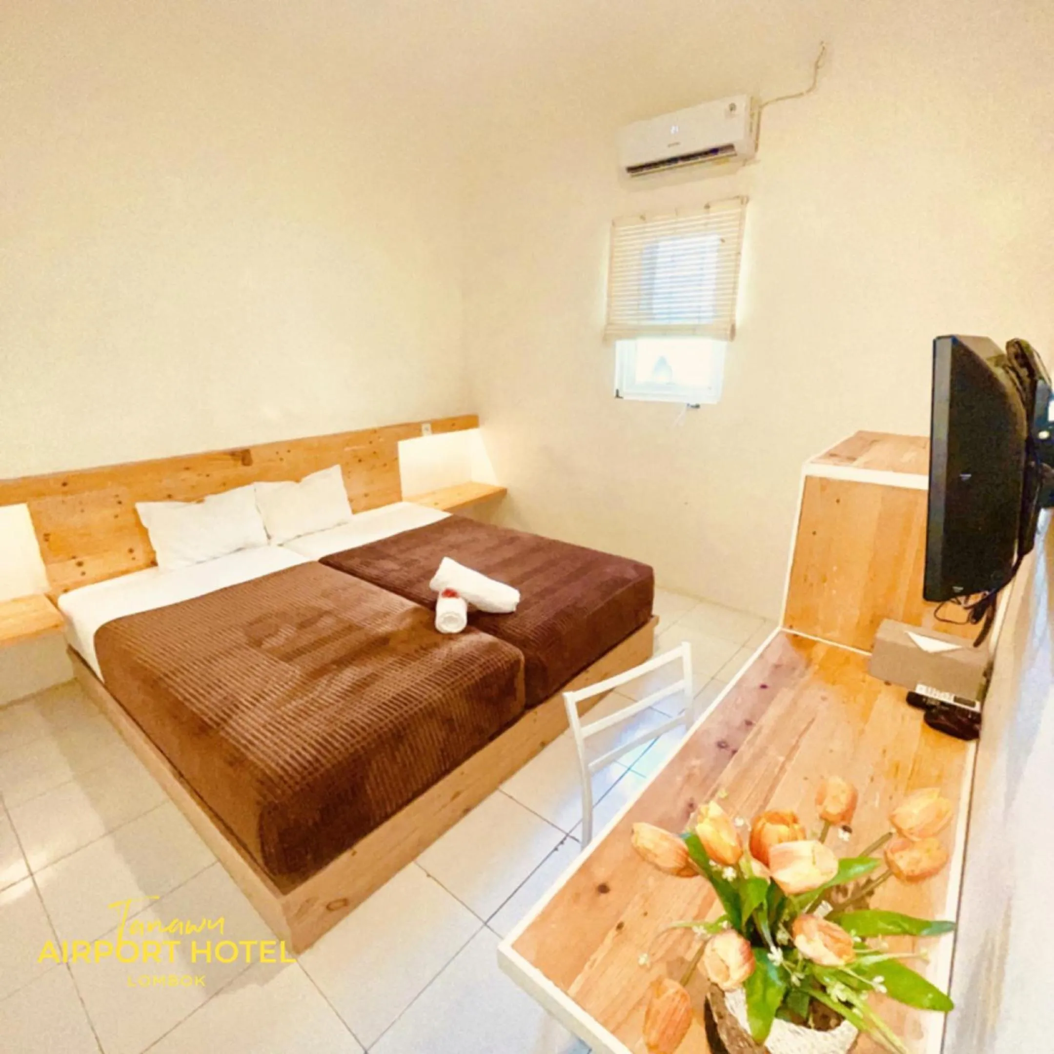 Bed in TANAWU AIRPORT HOTEL LOMBOK