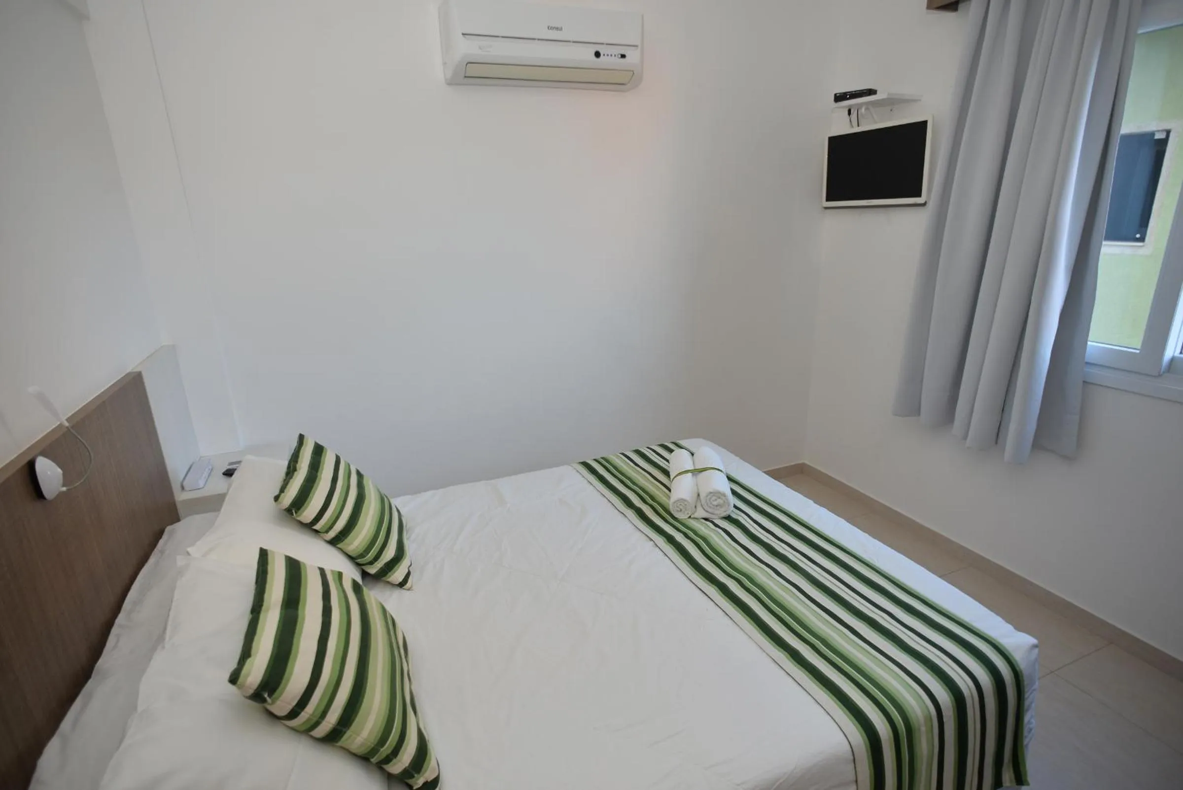 Bed in Pousada Villa Maciel