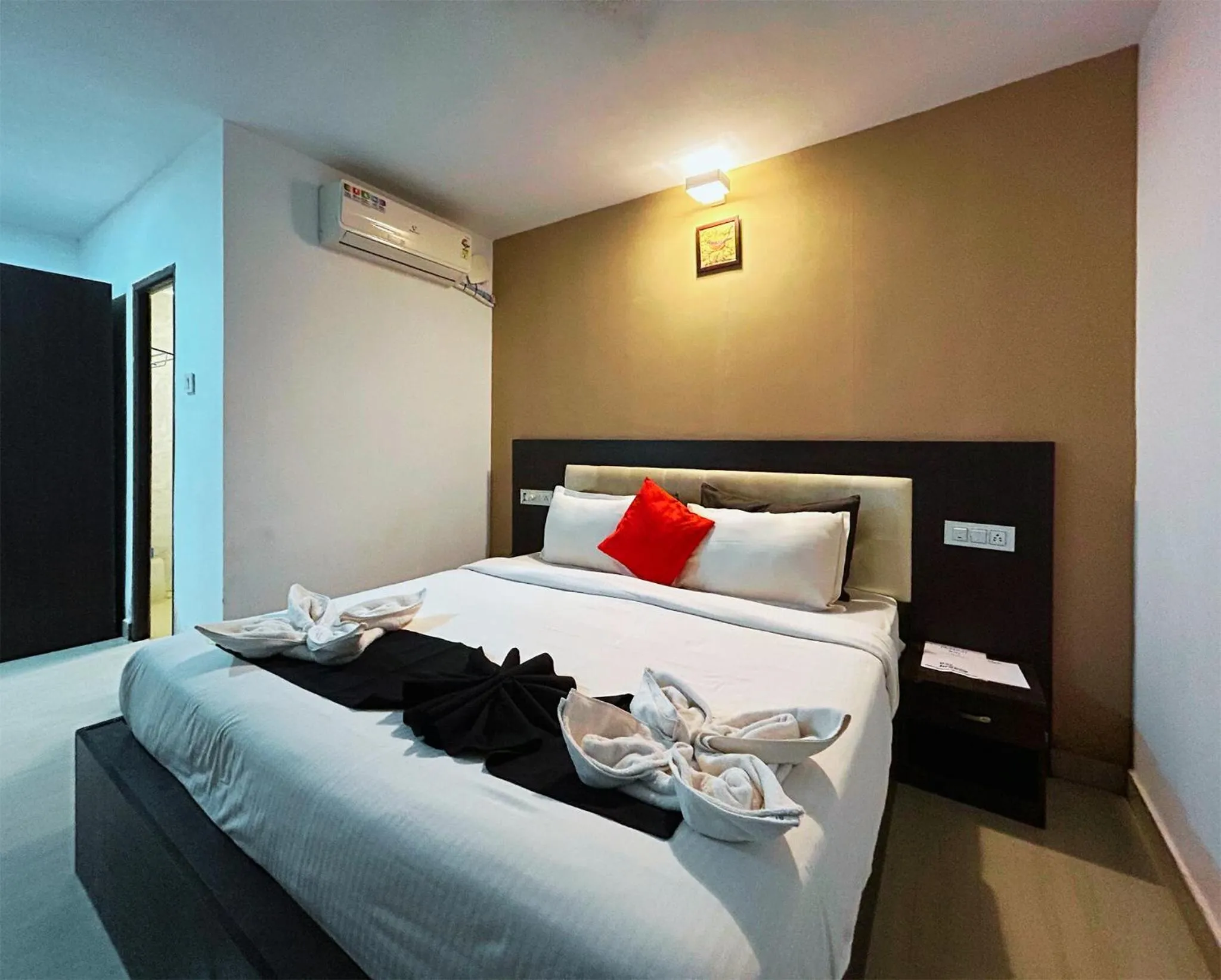 Bed in Bay Breeze Resorts & Hotels