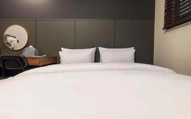 Bed in Brown Dot Hotel Suwon Jeongja Branch