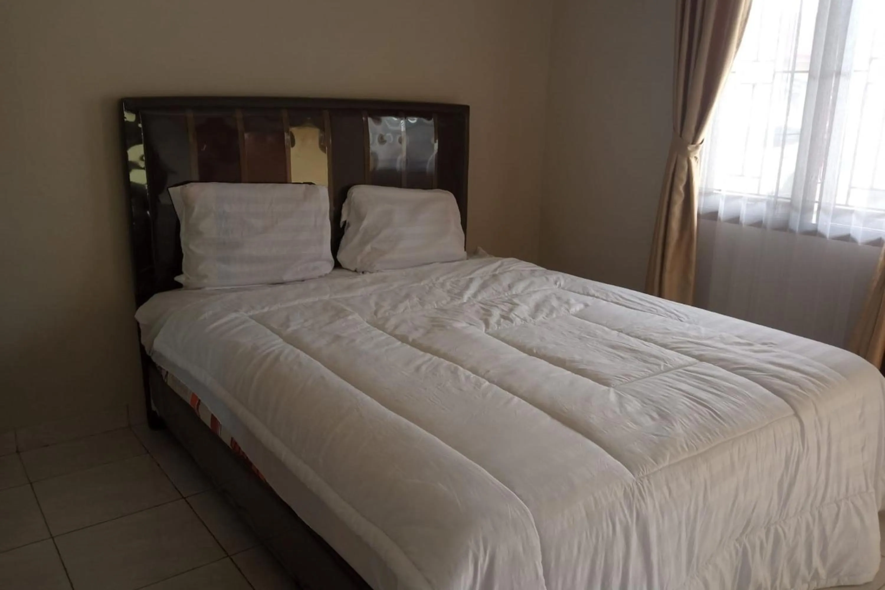 Photo of the whole room, Bed in Hotel O Njy House SyariahNearBandara Sultan Syarif Kasim II