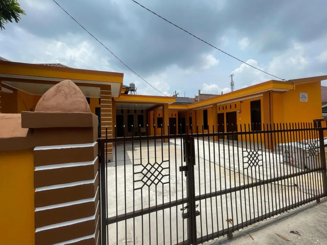 Facade/entrance in Hotel O Neva Guest House SyariahNearWaduk Cipta Karya