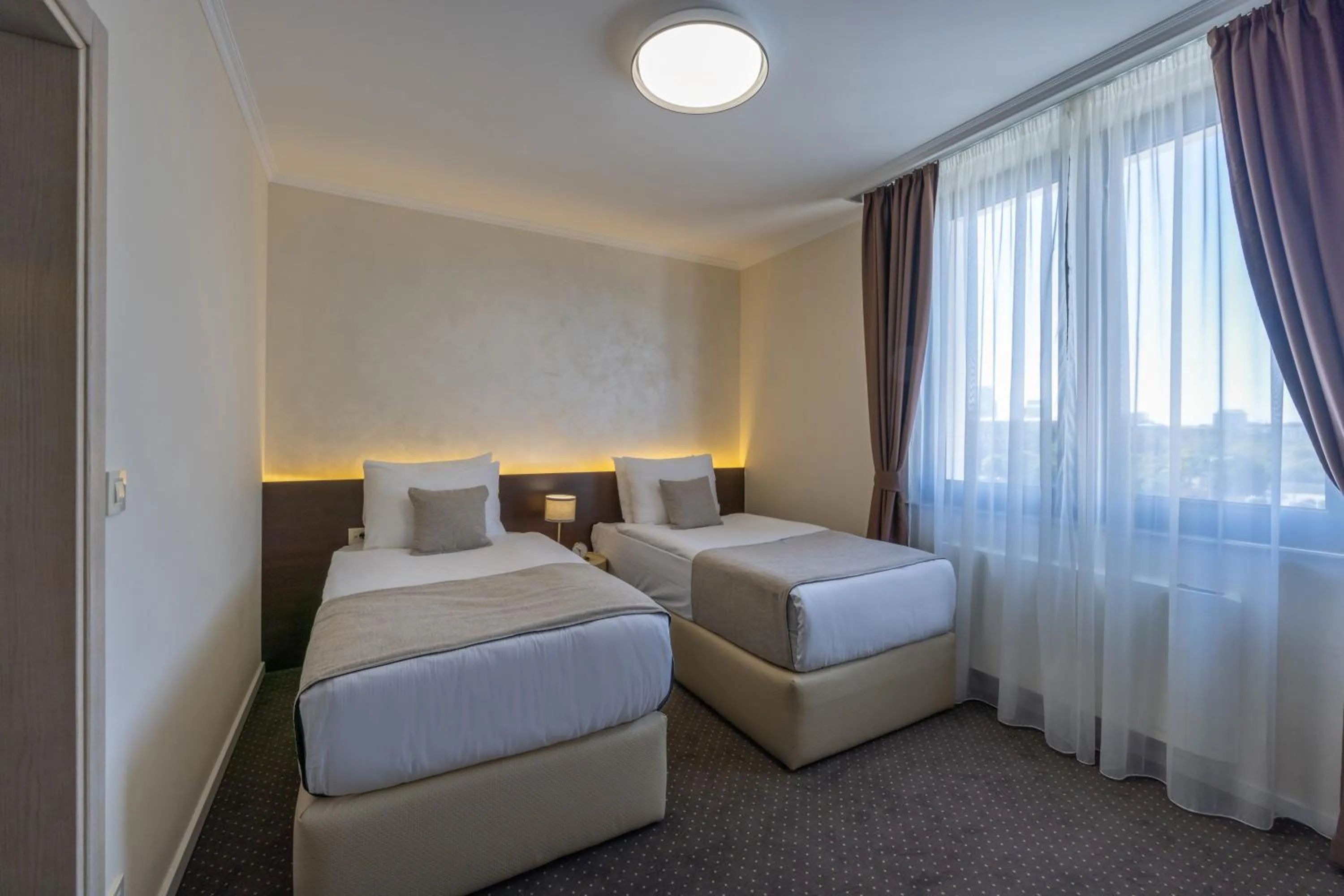 Bed in Nobel West Hotel