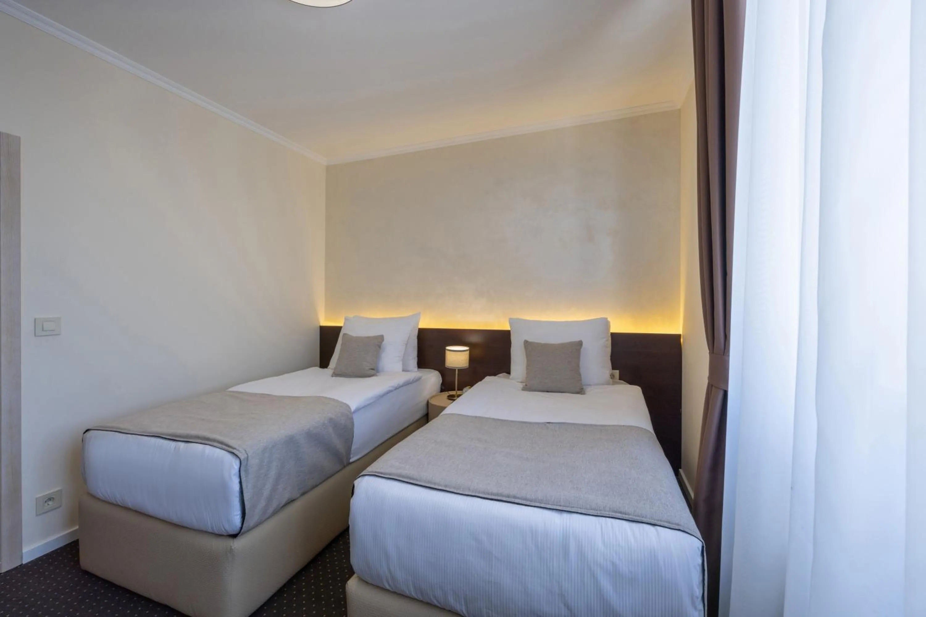 Bed in Nobel West Hotel