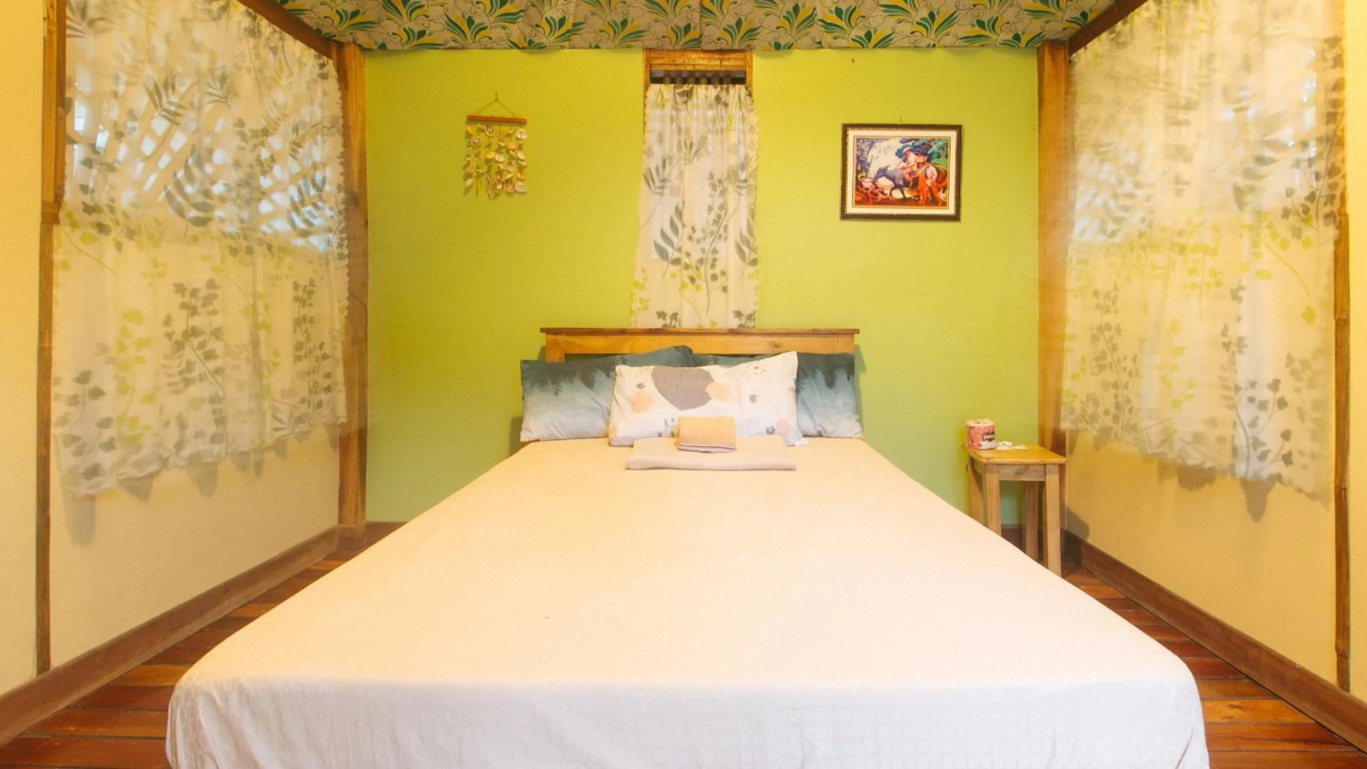 Bed in The Clara Beach and Guest House