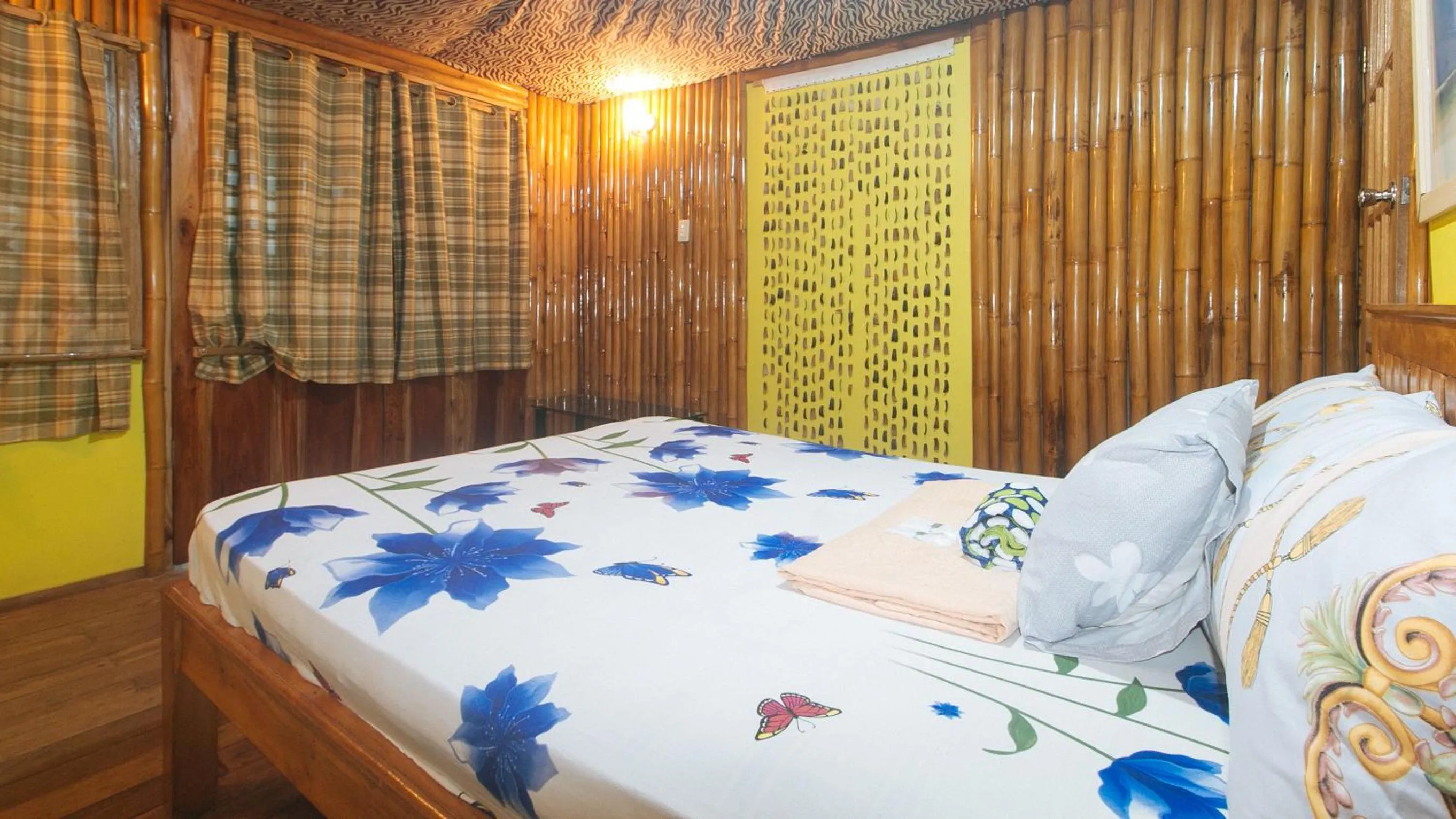 Bed in The Clara Beach and Guest House