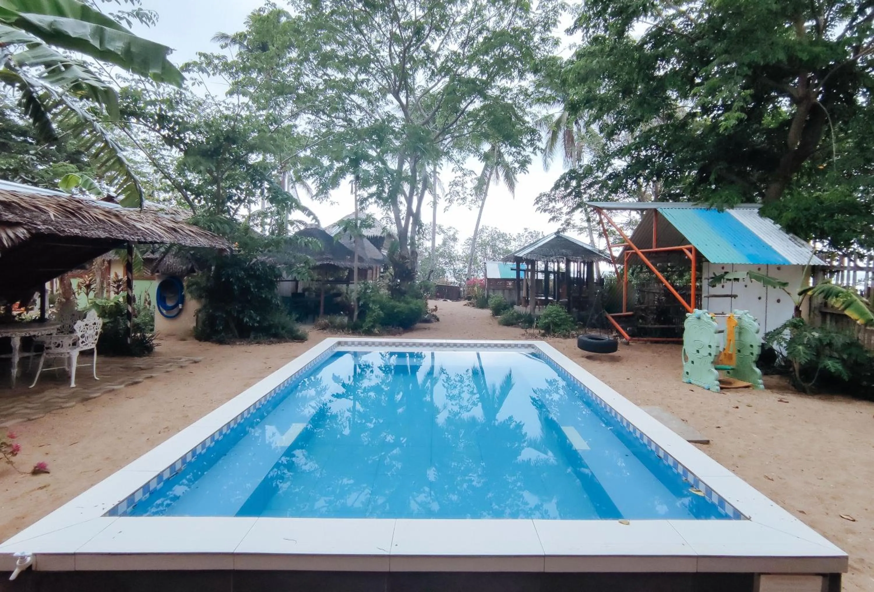 Swimming pool in The Clara Beach and Guest House