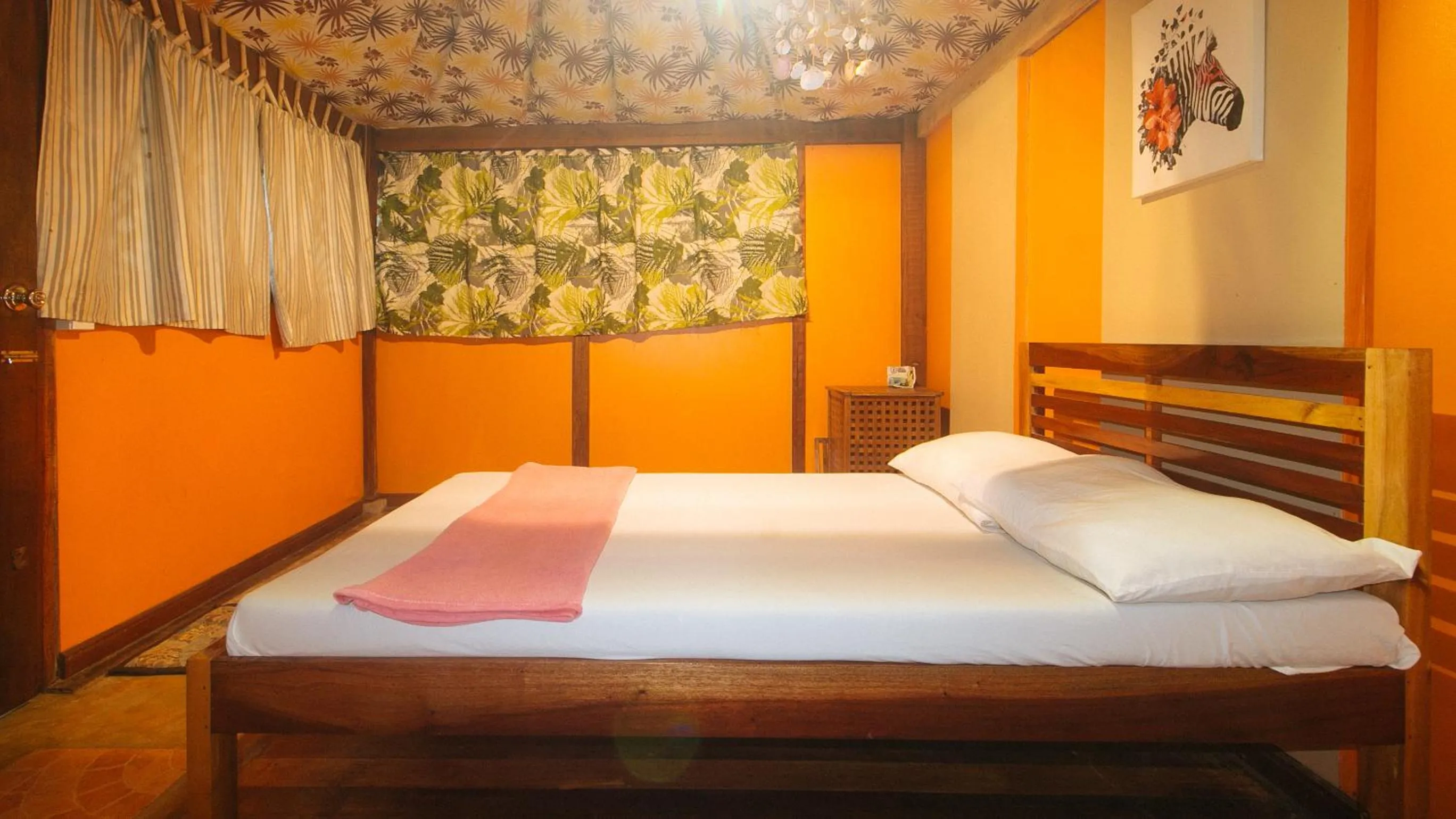 Bed in The Clara Beach and Guest House