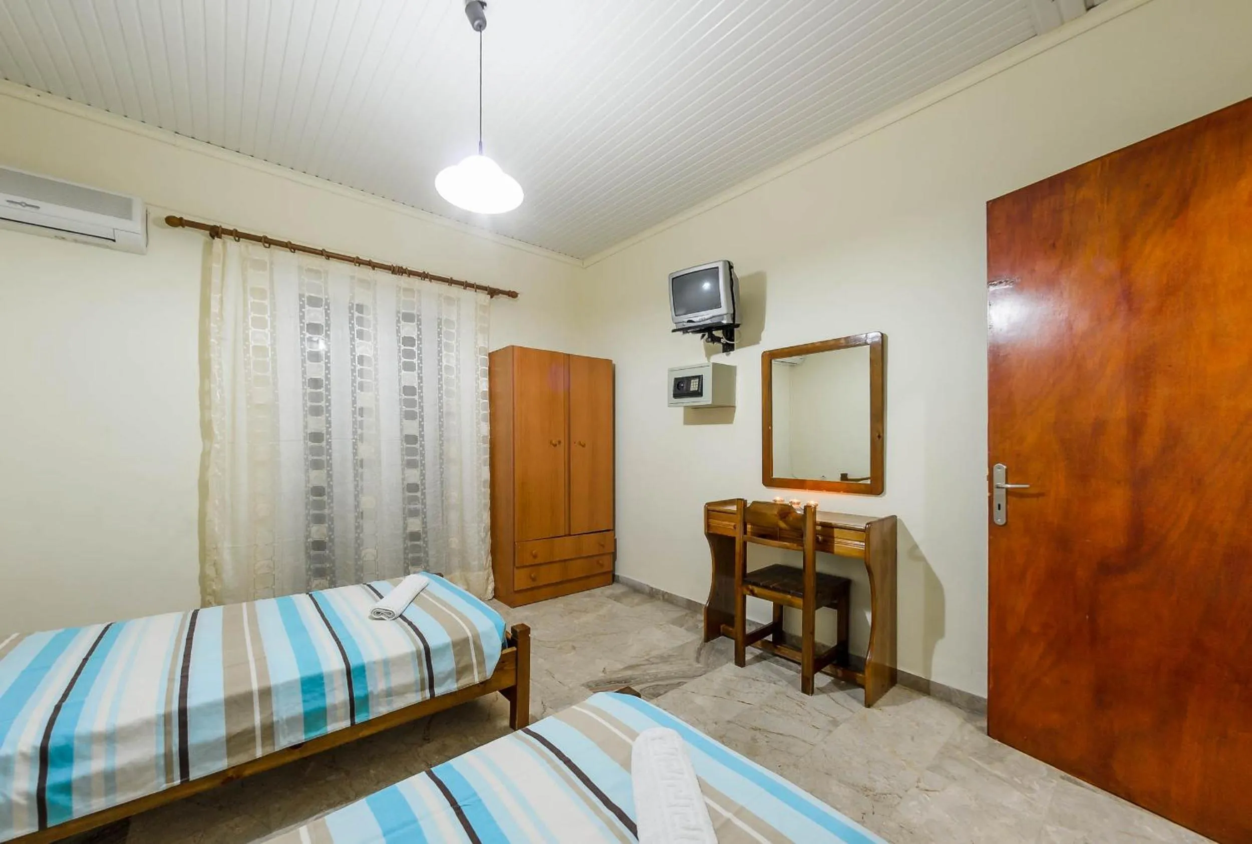Bed in Borsalino Studios & Apartments