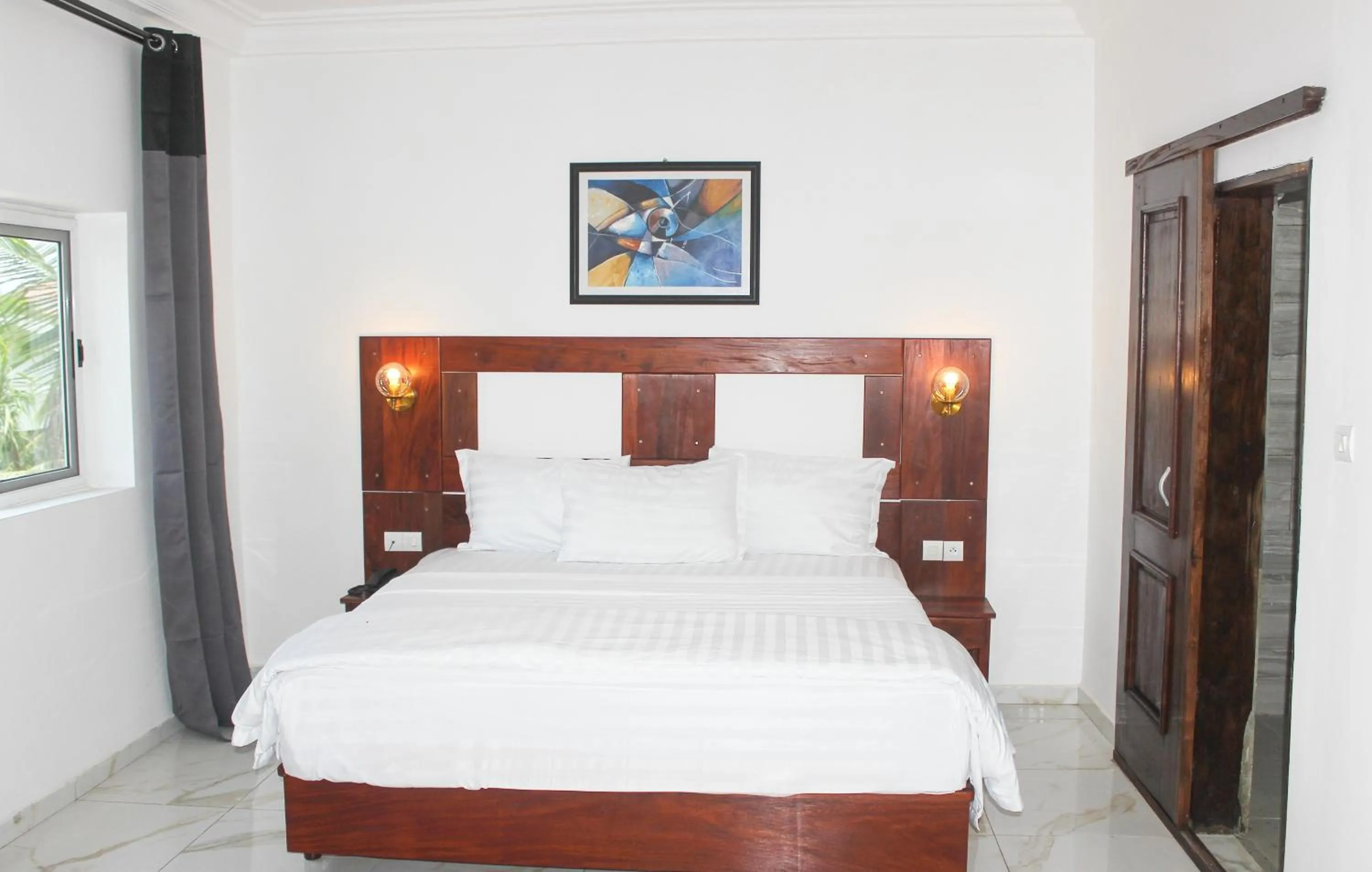 Bed in Hotel BKBG Benin