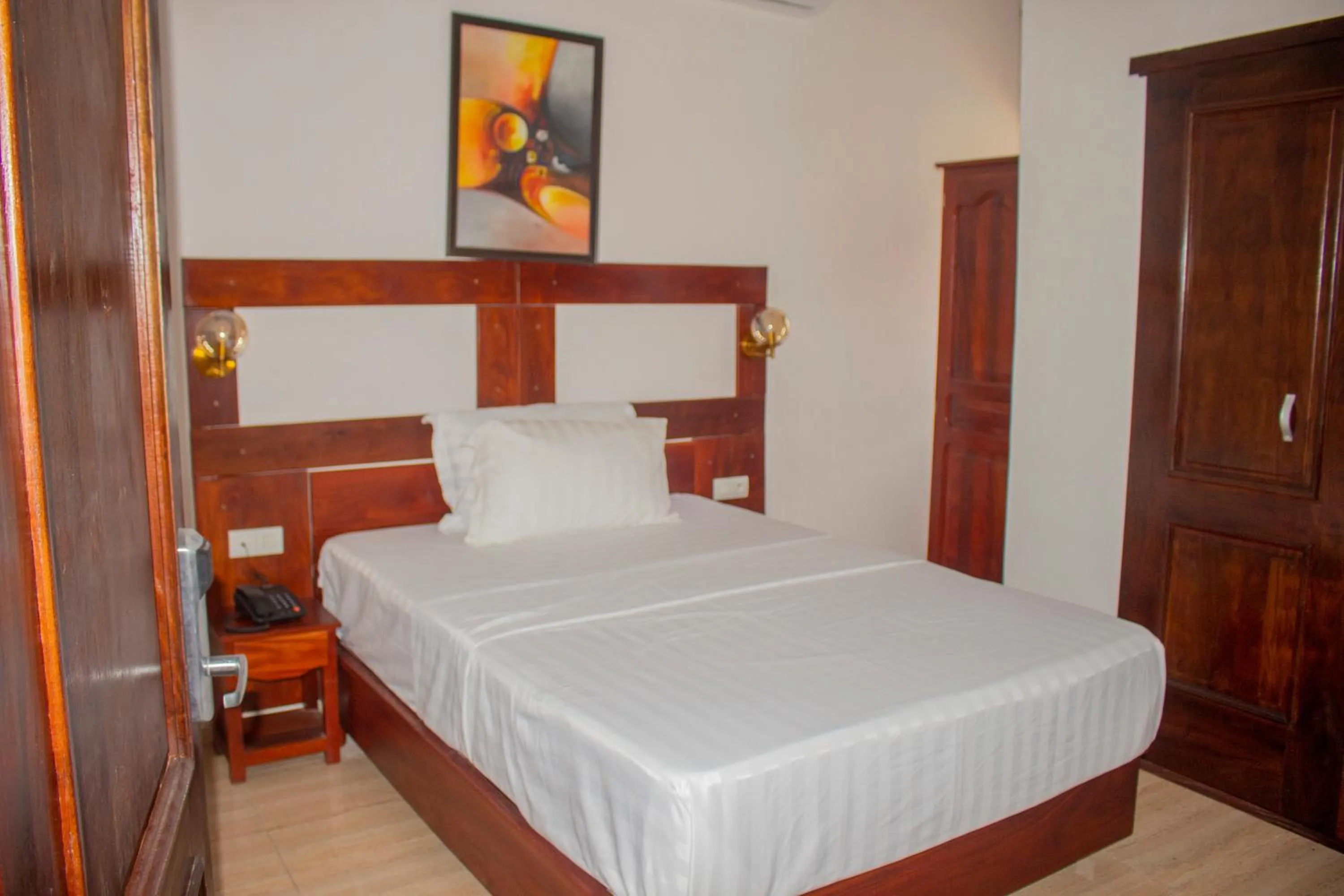 Bed in Hotel BKBG Benin