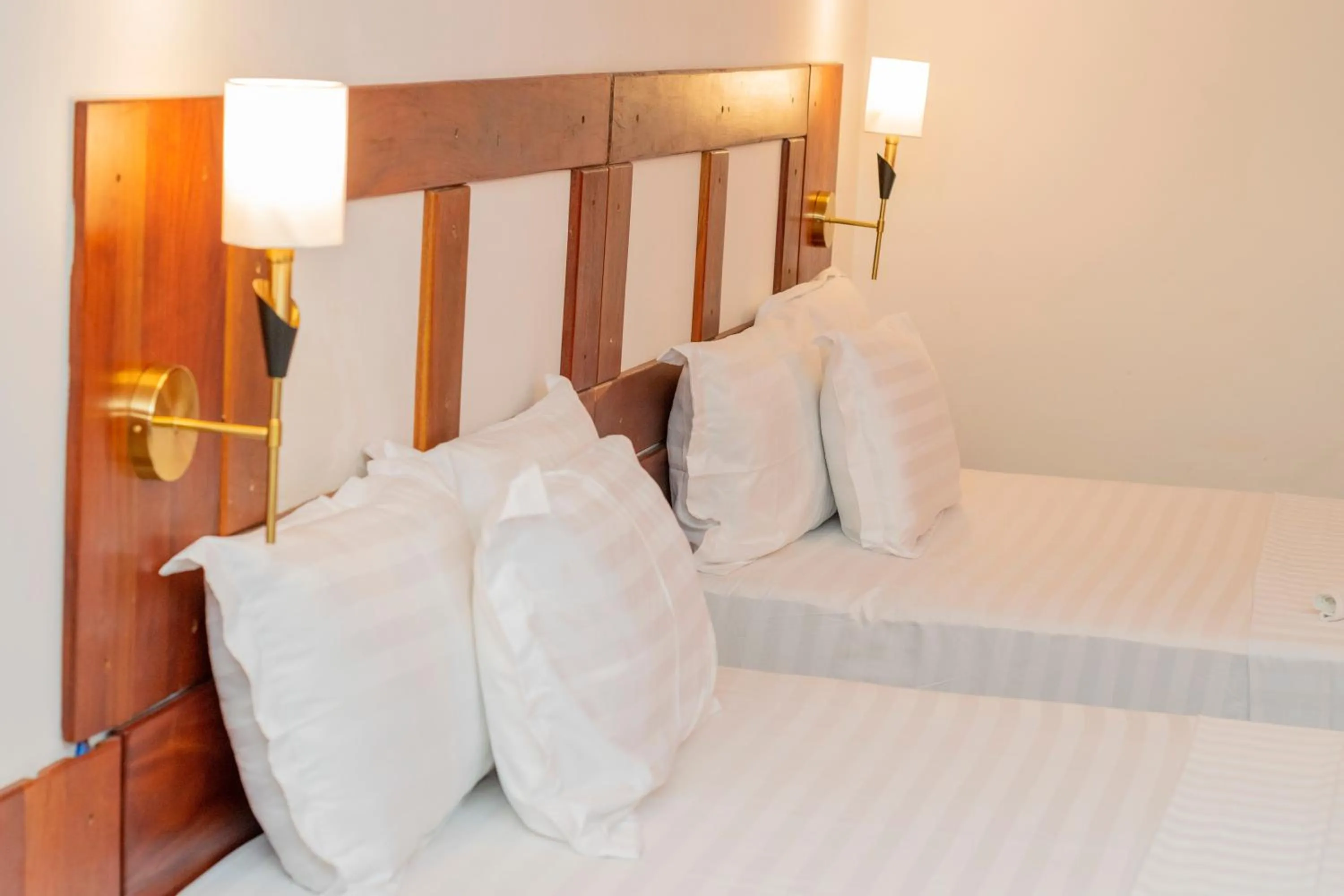 Bed in Hotel BKBG Benin