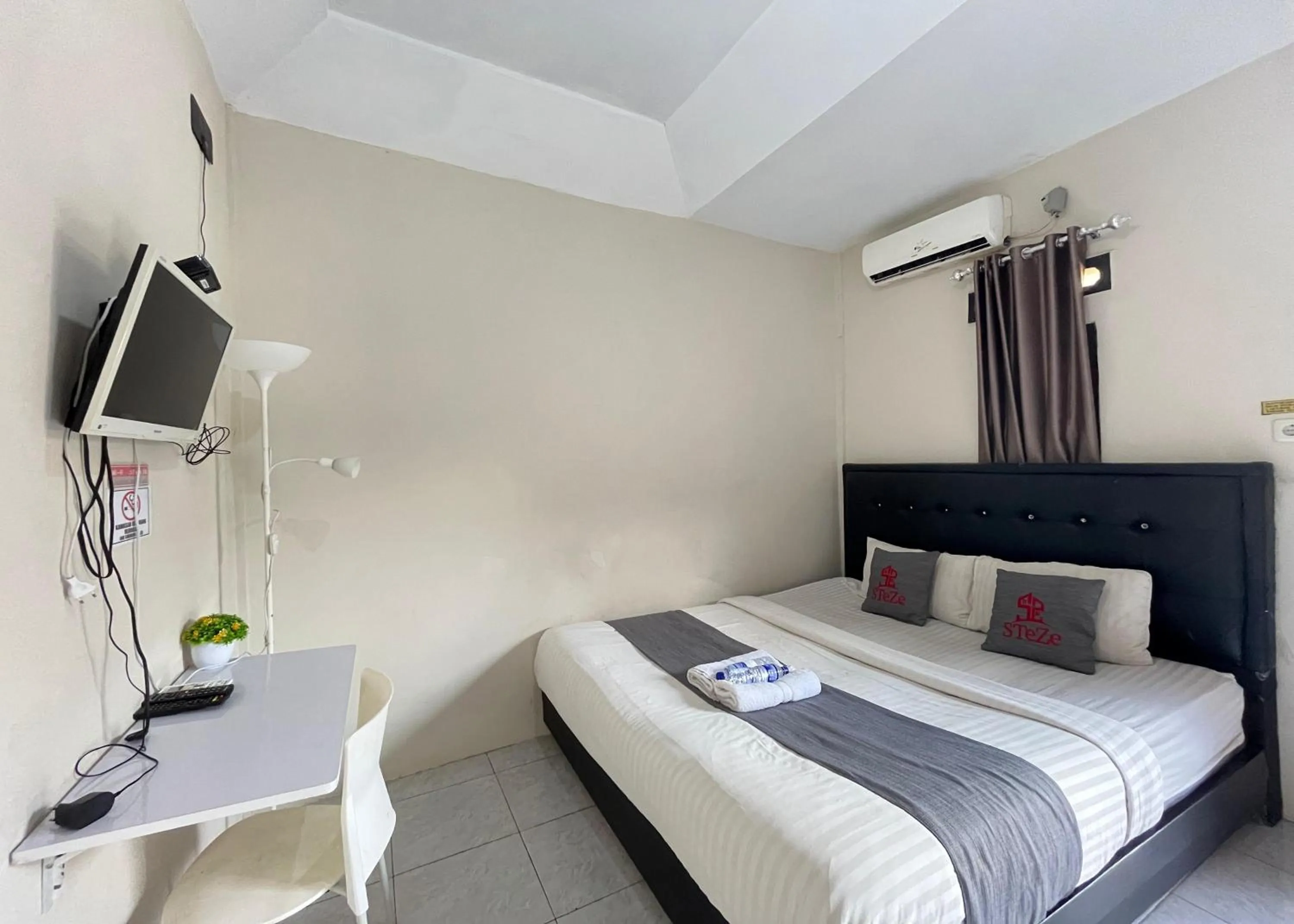 Bed in Steze Guesthouse Syariah Telanaipura