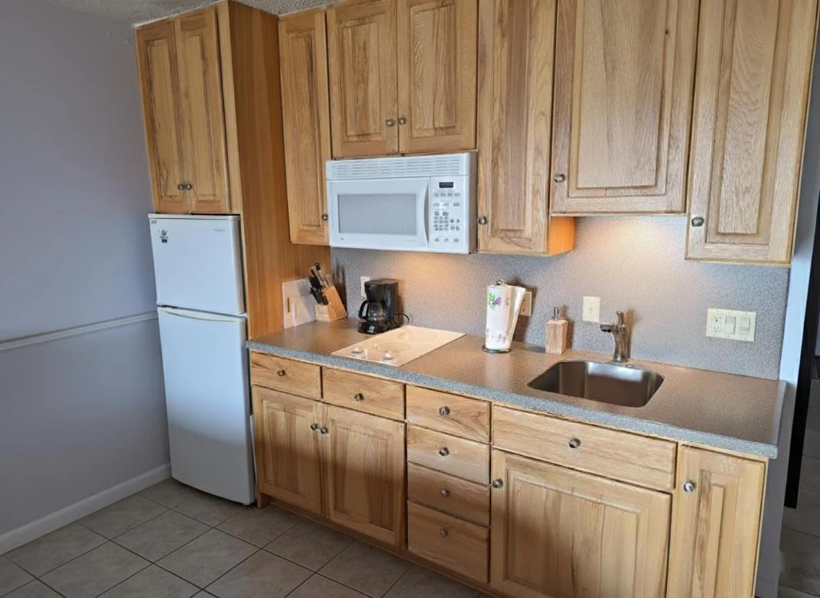 Kitchen or kitchenette in Pointes North Beachfront Hotel - 2 Person Spa Tub Studios